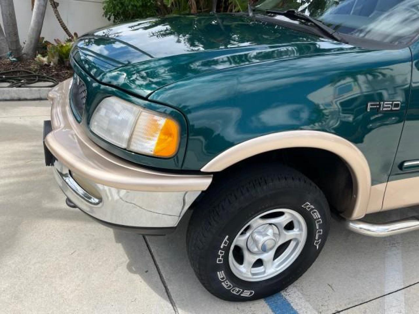 1997 Pacific Green (CC/Met) /Medium Prarie Tan Ford F-150 4WD Lariat LOW MILES 89,299 (1FTDX1860VK) with an 4.6L EFI OHC V8 Triton Engine engine, Automatic transmission, located at 4701 North Dixie Hwy, Pompano Beach, FL, 33064, (954) 422-2889, 26.240938, -80.123474 - OUR WEBPAGE FLORIDACARS1.COM HAS OVER 100 PHOTOS AND FREE CARFAX LINK 1997 FORD F-150 ROAD READY WORK READY VIN: 1FTDX1860VKA73358 NO ACCIDENTS 4X4 3 DOOR EXTENDED CAB PICKUP NO RECALLS 4.6L V8 4.6L V8 F 4X4 FLORIDA OWNER GASOLINE 20 SERVICE RECORDS POWER LEATHER SEATS REAR WHEEL DRIVE W/ 4X4 8 FT B - Photo#76