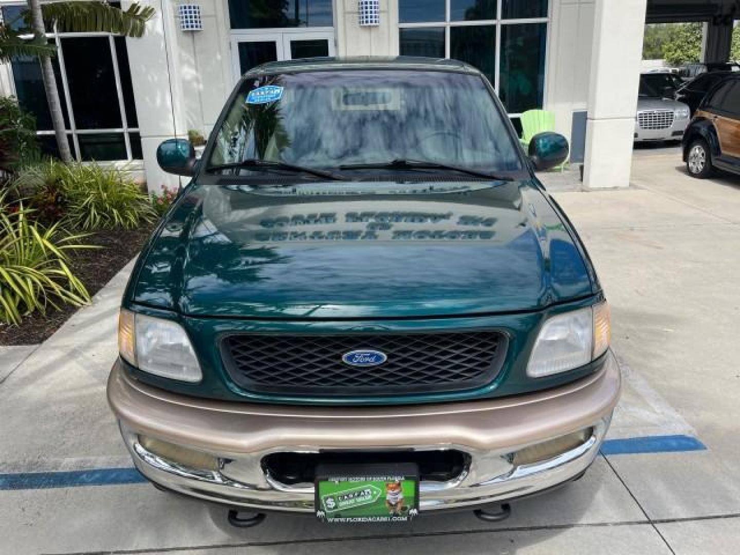 1997 Pacific Green (CC/Met) /Medium Prarie Tan Ford F-150 4WD Lariat LOW MILES 89,299 (1FTDX1860VK) with an 4.6L EFI OHC V8 Triton Engine engine, Automatic transmission, located at 4701 North Dixie Hwy, Pompano Beach, FL, 33064, (954) 422-2889, 26.240938, -80.123474 - OUR WEBPAGE FLORIDACARS1.COM HAS OVER 100 PHOTOS AND FREE CARFAX LINK 1997 FORD F-150 ROAD READY WORK READY VIN: 1FTDX1860VKA73358 NO ACCIDENTS 4X4 3 DOOR EXTENDED CAB PICKUP NO RECALLS 4.6L V8 4.6L V8 F 4X4 FLORIDA OWNER GASOLINE 20 SERVICE RECORDS POWER LEATHER SEATS REAR WHEEL DRIVE W/ 4X4 8 FT B - Photo#81