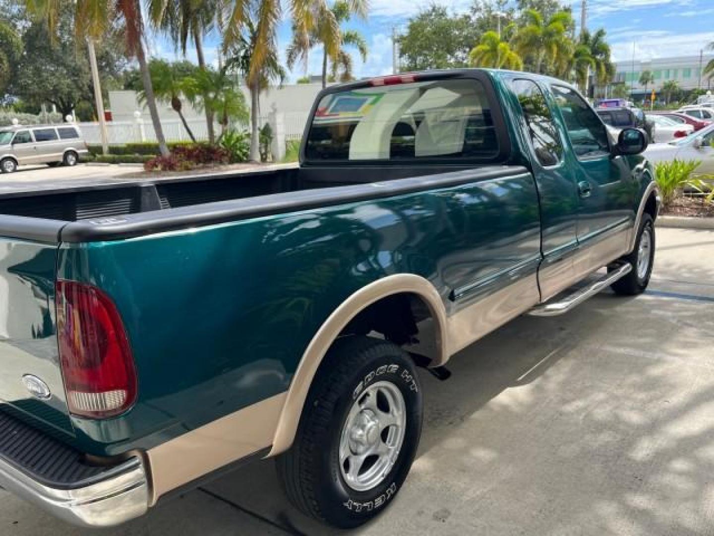 1997 Pacific Green (CC/Met) /Medium Prarie Tan Ford F-150 4WD Lariat LOW MILES 89,299 (1FTDX1860VK) with an 4.6L EFI OHC V8 Triton Engine engine, Automatic transmission, located at 4701 North Dixie Hwy, Pompano Beach, FL, 33064, (954) 422-2889, 26.240938, -80.123474 - OUR WEBPAGE FLORIDACARS1.COM HAS OVER 100 PHOTOS AND FREE CARFAX LINK 1997 FORD F-150 ROAD READY WORK READY VIN: 1FTDX1860VKA73358 NO ACCIDENTS 4X4 3 DOOR EXTENDED CAB PICKUP NO RECALLS 4.6L V8 4.6L V8 F 4X4 FLORIDA OWNER GASOLINE 20 SERVICE RECORDS POWER LEATHER SEATS REAR WHEEL DRIVE W/ 4X4 8 FT B - Photo#87