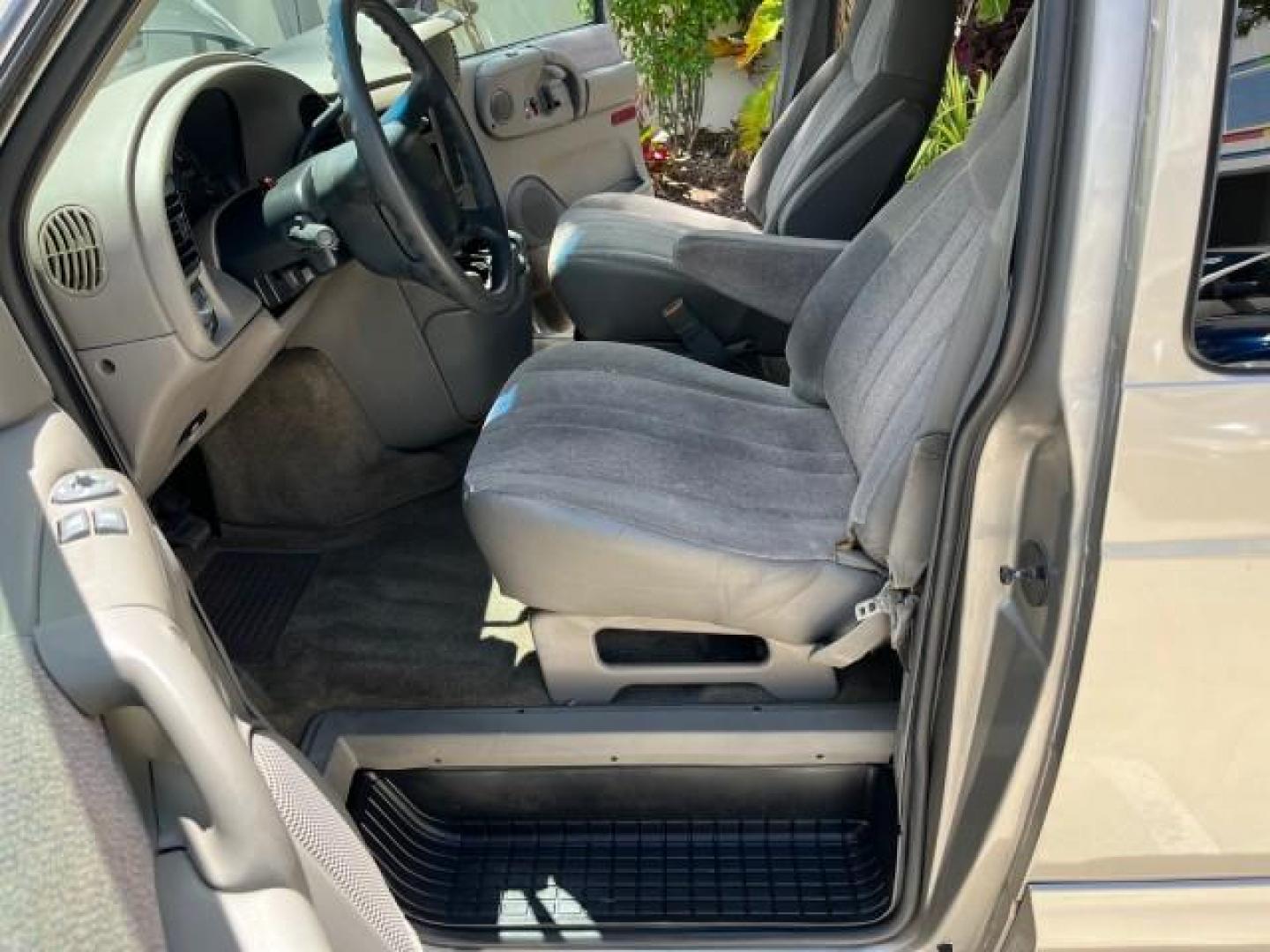 2002 Storm Gray Metallic /Pewter GMC Safari Passenger 7 PASS LOW MILES 58,918 (1GKDM19XX2B) with an 4.3L Vortec 4300 SFI V6 Engine engine, Automatic transmission, located at 4701 North Dixie Hwy, Pompano Beach, FL, 33064, (954) 422-2889, 26.240938, -80.123474 - OUR WEBPAGE FLORIDACARS1.COM HAS OVER 100 PHOTOS AND FREE CARFAX LINK 2002 GMC SAFARI SLE ROAD READY 4.3L V6 VIN: 1GKDM19XX2B506507 NO RECALLS VAN 1 OWNER SLE 4.3L V6 F OHV 12V LOW MILES 58,918 GASOLINE 7 PASSANGER REAR WHEEL DRIVE 15 SERVICE RECORDS Anti-Theft System Approach Lights Black Roof Rack - Photo#10