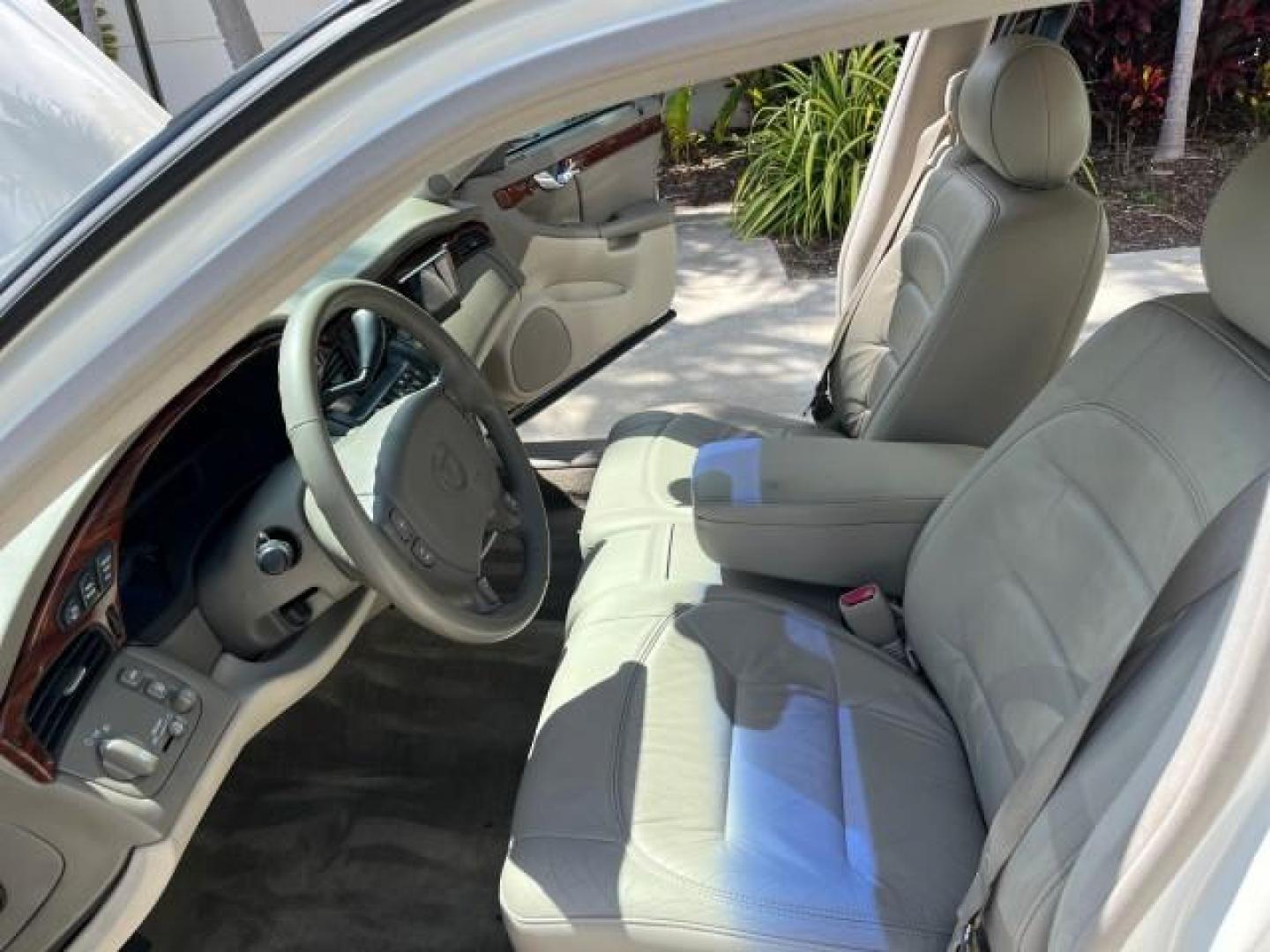 2003 White Diamond /Oatmeal Cadillac DeVille LOW MILES 48,021 (1G6KD54Y63U) with an 4.6L DOHC V8 Northstar Engine engine, Automatic transmission, located at 4701 North Dixie Hwy, Pompano Beach, FL, 33064, (954) 422-2889, 26.240938, -80.123474 - OUR WEBPAGE FLORIDACARS1.COM HAS OVER 100 PHOTOS AND FREE CARFAX LINK 2003 CADILLAC DEVILLE ROAD READY 4.6L V8 VIN: 1G6KD54Y63U260929 NO ACCIDENTS SEDAN 4 DR NO RECALLS DUAL AC 4.6L V8 F DOHC 32V 1 OWNER LEATHER GASOLINE LOW MILES 48,021 FRONT WHEEL DRIVE NEW $ 47,185 11 SERVICE RECORDS Air Suspensi - Photo#10