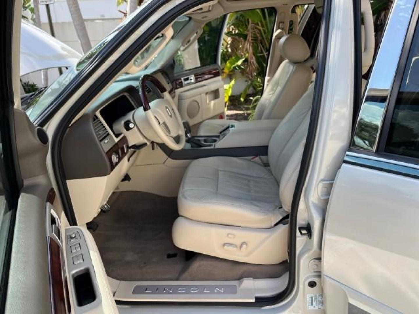 2004 Light French Silk Metallic /Light Parchment Lincoln Navigator `1 OWNER Ultimate LOW MILES 34,094 (5LMFU27R34L) with an 5.4L DOHC 32-Valve V8 Intech Engine engine, Automatic transmission, located at 4701 North Dixie Hwy, Pompano Beach, FL, 33064, (954) 422-2889, 26.240938, -80.123474 - OUR WEBPAGE FLORIDACARS1.COM HAS OVER 100 PHOTOS AND FREE CARFAX LINK 2004 LINCOLN NAVIGATOR LUXURY NEW $52,125 ROAD READY VIN: 5LMFU27R34LJ40460 NO ACCIDENTS NO RECALLS 4 DOOR WAGON/SPORT UTILITY 1 OWNER LOW MILES 34,094 5.4L V8 F DOHC 3 ROW LEATHER SEATS DVD GASOLINE PARK SENSORS SUNROOF REAR WHEE - Photo#10