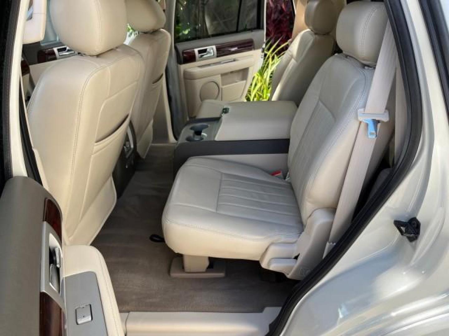 2004 Light French Silk Metallic /Light Parchment Lincoln Navigator `1 OWNER Ultimate LOW MILES 34,094 (5LMFU27R34L) with an 5.4L DOHC 32-Valve V8 Intech Engine engine, Automatic transmission, located at 4701 North Dixie Hwy, Pompano Beach, FL, 33064, (954) 422-2889, 26.240938, -80.123474 - OUR WEBPAGE FLORIDACARS1.COM HAS OVER 100 PHOTOS AND FREE CARFAX LINK 2004 LINCOLN NAVIGATOR LUXURY NEW $52,125 ROAD READY VIN: 5LMFU27R34LJ40460 NO ACCIDENTS NO RECALLS 4 DOOR WAGON/SPORT UTILITY 1 OWNER LOW MILES 34,094 5.4L V8 F DOHC 3 ROW LEATHER SEATS DVD GASOLINE PARK SENSORS SUNROOF REAR WHEE - Photo#14