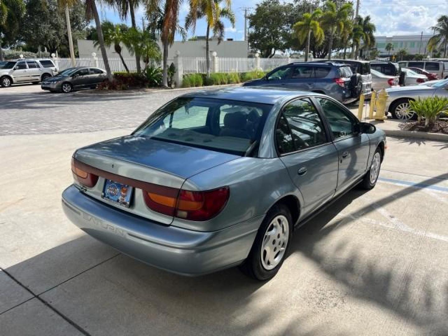 2002 Blue /Grey Saturn SL2 1 OWNER LOW MILES 79,900 (1G8ZK52782Z) with an 1.9L DOHC SPFI 16-Valve L4 Aluminum Engine engine, Automatic transmission, located at 4701 North Dixie Hwy, Pompano Beach, FL, 33064, (954) 422-2889, 26.240938, -80.123474 - OUR WEBPAGE FLORIDACARS1.COM HAS OVER 100 PHOTOS AND FREE CARFAX LINK 2002 SATURN S-SERIES SL2 ROAD READY 1.9L I4 VIN: 1G8ZK52782Z216972 NO ACCIDENTS SEDAN 4 DR NO RECALLS 1.9L I4 F DOHC 16V 1 OWNER 38 MPG GASOLINE LOW MILES 79,900 FRONT WHEEL DRIVE FWD Front Bucket Seats THIS IS ONE OF THE NICEST S - Photo#84