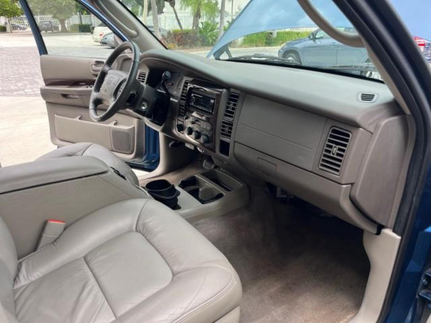 2001 Patriot Blue Pearl /Slate Gray/Taupe Dodge Durango 4WD 1 FL LOW MILES 39,516 (1B4HS28N41F) with an 4.7L SOHC SMPI V8 Magnum Engine engine, Automatic transmission, located at 4701 North Dixie Hwy, Pompano Beach, FL, 33064, (954) 422-2889, 26.240938, -80.123474 - OUR WEBPAGE FLORIDACARS1.COM HAS OVER 100 PHOTOS AND FREE CARFAX LINK 2001 DODGE DURANGO SLT ROAD READY 4.7L V8 VIN: 1B4HS28N41F637509 NO ACCIDENTS 4 DOOR WAGON/SPORT UTILITY 1 OWNER FLORIDA 4.7L V8 F OHV 4X4 ON DEMAND 4WD GASOLINE DUAL AC LOW MILES 39,516 REAR WHEEL DRIVE W/ 4X4 POWER SEATS 3 ROW L - Photo#27