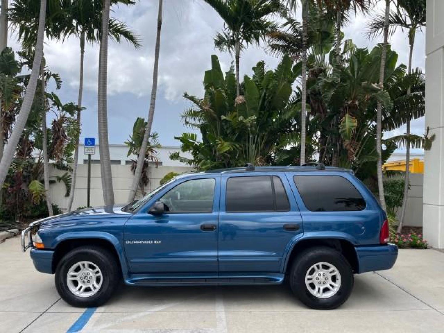 2001 Patriot Blue Pearl /Slate Gray/Taupe Dodge Durango 4WD 1 FL LOW MILES 39,516 (1B4HS28N41F) with an 4.7L SOHC SMPI V8 Magnum Engine engine, Automatic transmission, located at 4701 North Dixie Hwy, Pompano Beach, FL, 33064, (954) 422-2889, 26.240938, -80.123474 - OUR WEBPAGE FLORIDACARS1.COM HAS OVER 100 PHOTOS AND FREE CARFAX LINK 2001 DODGE DURANGO SLT ROAD READY 4.7L V8 VIN: 1B4HS28N41F637509 NO ACCIDENTS 4 DOOR WAGON/SPORT UTILITY 1 OWNER FLORIDA 4.7L V8 F OHV 4X4 ON DEMAND 4WD GASOLINE DUAL AC LOW MILES 39,516 REAR WHEEL DRIVE W/ 4X4 POWER SEATS 3 ROW L - Photo#4