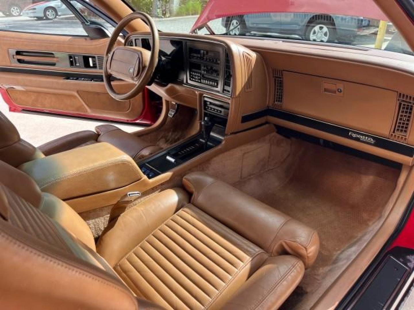 1990 RED /TAN Buick Reatta CONV 1 FL LOW MILES 58,135 (1G4EC33C9LB) with an 3.8L 3800 SFI V6 Engine engine, Automatic transmission, located at 4701 North Dixie Hwy, Pompano Beach, FL, 33064, (954) 422-2889, 26.240938, -80.123474 - OUR WEBPAGE FLORIDACARS1.COM HAS OVER 100 PHOTOS AND FREE CARFAX LINK 1990 BUICK REATTA ROAD READY 3.8L V6 VIN: 1G4EC33C9LB908410 CONVERTIBLE TOP CONVERTIBLE 1 OWNER FLORIDA 3.8L V6 F 12V THE BEST LOW MILES 58,135 GASOLINE POWER LEATHER SEATS FRONT WHEEL DRIVE NO RECALLS THIS IS ONE OF THE NICEST BU - Photo#14