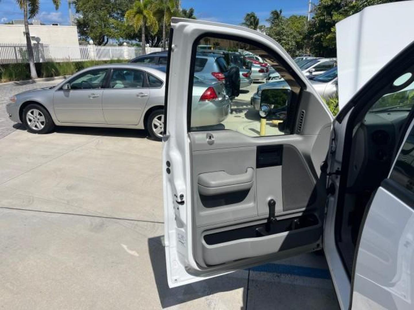 2005 Oxford White /Flint Ford F-150 1 FL XL LOW MILES 63,772 (1FTRF12245N) with an 4.2L EFI V6 Engine engine, Automatic transmission, located at 4701 North Dixie Hwy, Pompano Beach, FL, 33064, (954) 422-2889, 26.240938, -80.123474 - OUR WEBPAGE FLORIDACARS1.COM HAS OVER 100 PHOTOS AND FREE CARFAX LINK 2005 FORD F-150 XL ROAD READY WORK READY VIN: 1FTRF12245NA98700 NO ACCIDENTS 4,2L V6 4.2L V6 F OHV NO RECALLS 8.0 FT BED GASOLINE 1 OWNER FLORIDA REAR WHEEL DRIVE VERY CLEAN LOW MILES 63,772 ABS Brakes Air Conditioning CD Audio AM - Photo#9