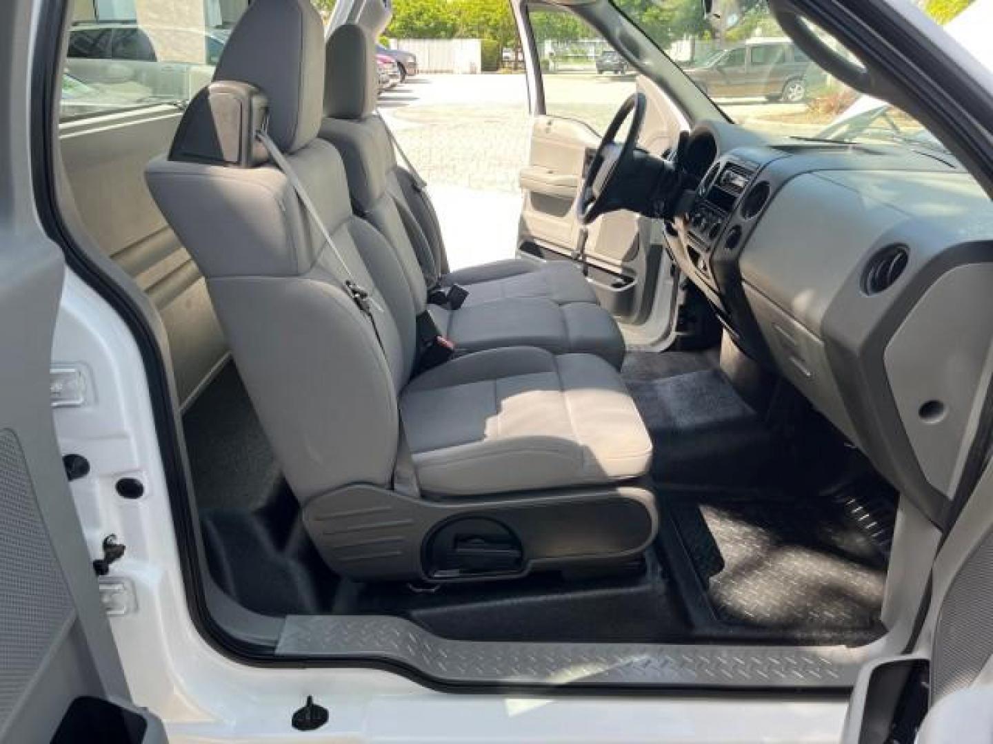 2005 Oxford White /Flint Ford F-150 1 FL XL LOW MILES 63,772 (1FTRF12245N) with an 4.2L EFI V6 Engine engine, Automatic transmission, located at 4701 North Dixie Hwy, Pompano Beach, FL, 33064, (954) 422-2889, 26.240938, -80.123474 - OUR WEBPAGE FLORIDACARS1.COM HAS OVER 100 PHOTOS AND FREE CARFAX LINK 2005 FORD F-150 XL ROAD READY WORK READY VIN: 1FTRF12245NA98700 NO ACCIDENTS 4,2L V6 4.2L V6 F OHV NO RECALLS 8.0 FT BED GASOLINE 1 OWNER FLORIDA REAR WHEEL DRIVE VERY CLEAN LOW MILES 63,772 ABS Brakes Air Conditioning CD Audio AM - Photo#13