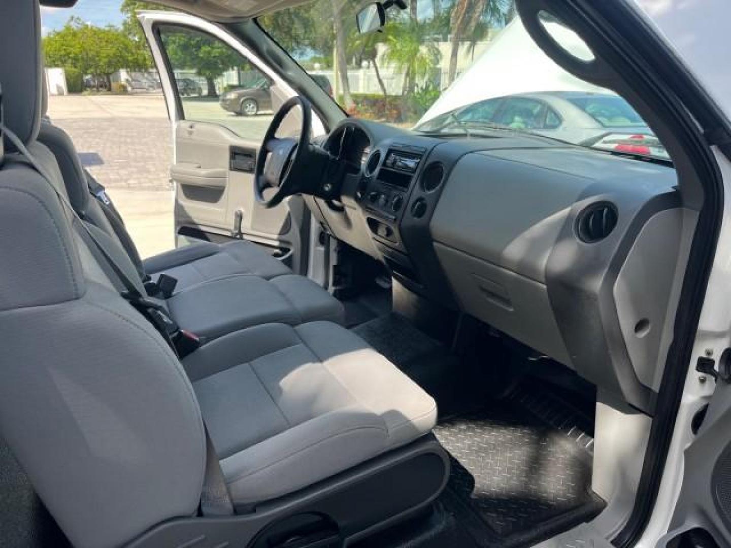 2005 Oxford White /Flint Ford F-150 1 FL XL LOW MILES 63,772 (1FTRF12245N) with an 4.2L EFI V6 Engine engine, Automatic transmission, located at 4701 North Dixie Hwy, Pompano Beach, FL, 33064, (954) 422-2889, 26.240938, -80.123474 - OUR WEBPAGE FLORIDACARS1.COM HAS OVER 100 PHOTOS AND FREE CARFAX LINK 2005 FORD F-150 XL ROAD READY WORK READY VIN: 1FTRF12245NA98700 NO ACCIDENTS 4,2L V6 4.2L V6 F OHV NO RECALLS 8.0 FT BED GASOLINE 1 OWNER FLORIDA REAR WHEEL DRIVE VERY CLEAN LOW MILES 63,772 ABS Brakes Air Conditioning CD Audio AM - Photo#28