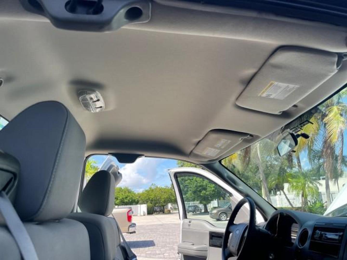 2005 Oxford White /Flint Ford F-150 1 FL XL LOW MILES 63,772 (1FTRF12245N) with an 4.2L EFI V6 Engine engine, Automatic transmission, located at 4701 North Dixie Hwy, Pompano Beach, FL, 33064, (954) 422-2889, 26.240938, -80.123474 - OUR WEBPAGE FLORIDACARS1.COM HAS OVER 100 PHOTOS AND FREE CARFAX LINK 2005 FORD F-150 XL ROAD READY WORK READY VIN: 1FTRF12245NA98700 NO ACCIDENTS 4,2L V6 4.2L V6 F OHV NO RECALLS 8.0 FT BED GASOLINE 1 OWNER FLORIDA REAR WHEEL DRIVE VERY CLEAN LOW MILES 63,772 ABS Brakes Air Conditioning CD Audio AM - Photo#30