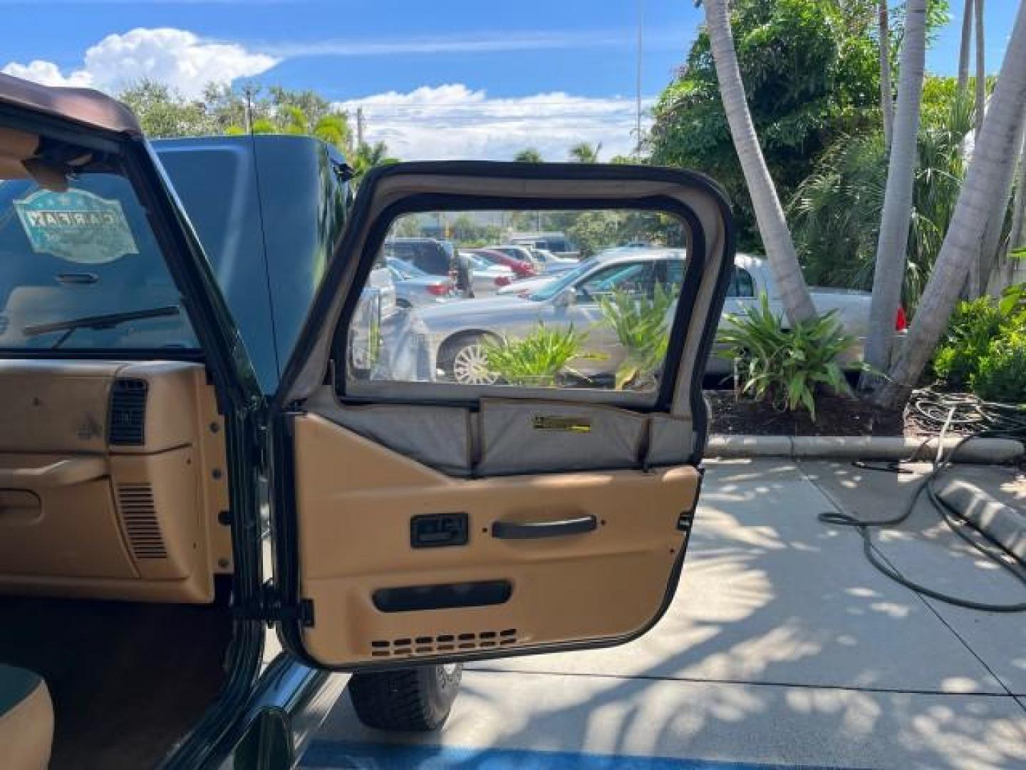 1998 Moss Green (PC) /Saddle Jeep Wrangler Sahara AUTO AC LOW MILES 60,233 (1J4FY49S2WP) with an 4.0L SMPI I6 Power Tech Engine engine, Automatic transmission, located at 4701 North Dixie Hwy, Pompano Beach, FL, 33064, (954) 422-2889, 26.240938, -80.123474 - OUR WEBPAGE FLORIDACARS1.COM HAS OVER 100 PHOTOS AND FREE CARFAX LINK 1998 JEEP WRANGLER SAHARA ROAD READY 4.0L I6 VIN: 1J4FY49S2WP723583 NO RECALLS 4X4 UTILITY (BLAZER, JIMMY, SCOUT, ETC.) LOW MILES 60,233 4.0L I6 F OHV FLORIDA OWNER GASOLINE CONVERTIBLE SOFT TOP REAR WHEEL DRIVE W/ 4X4 4X4 6 SERVI - Photo#11