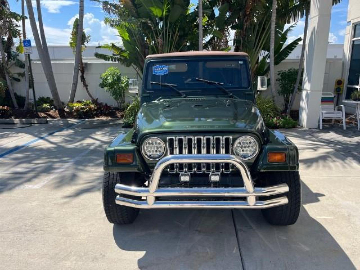 1998 Moss Green (PC) /Saddle Jeep Wrangler Sahara AUTO AC LOW MILES 60,233 (1J4FY49S2WP) with an 4.0L SMPI I6 Power Tech Engine engine, Automatic transmission, located at 4701 North Dixie Hwy, Pompano Beach, FL, 33064, (954) 422-2889, 26.240938, -80.123474 - OUR WEBPAGE FLORIDACARS1.COM HAS OVER 100 PHOTOS AND FREE CARFAX LINK 1998 JEEP WRANGLER SAHARA ROAD READY 4.0L I6 VIN: 1J4FY49S2WP723583 NO RECALLS 4X4 UTILITY (BLAZER, JIMMY, SCOUT, ETC.) LOW MILES 60,233 4.0L I6 F OHV FLORIDA OWNER GASOLINE CONVERTIBLE SOFT TOP REAR WHEEL DRIVE W/ 4X4 4X4 6 SERVI - Photo#2