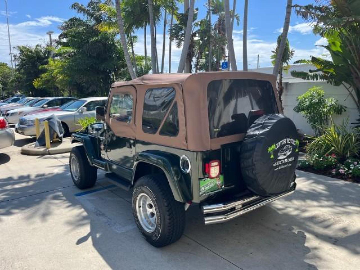 1998 Moss Green (PC) /Saddle Jeep Wrangler Sahara AUTO AC LOW MILES 60,233 (1J4FY49S2WP) with an 4.0L SMPI I6 Power Tech Engine engine, Automatic transmission, located at 4701 North Dixie Hwy, Pompano Beach, FL, 33064, (954) 422-2889, 26.240938, -80.123474 - OUR WEBPAGE FLORIDACARS1.COM HAS OVER 100 PHOTOS AND FREE CARFAX LINK 1998 JEEP WRANGLER SAHARA ROAD READY 4.0L I6 VIN: 1J4FY49S2WP723583 NO RECALLS 4X4 UTILITY (BLAZER, JIMMY, SCOUT, ETC.) LOW MILES 60,233 4.0L I6 F OHV FLORIDA OWNER GASOLINE CONVERTIBLE SOFT TOP REAR WHEEL DRIVE W/ 4X4 4X4 6 SERVI - Photo#5