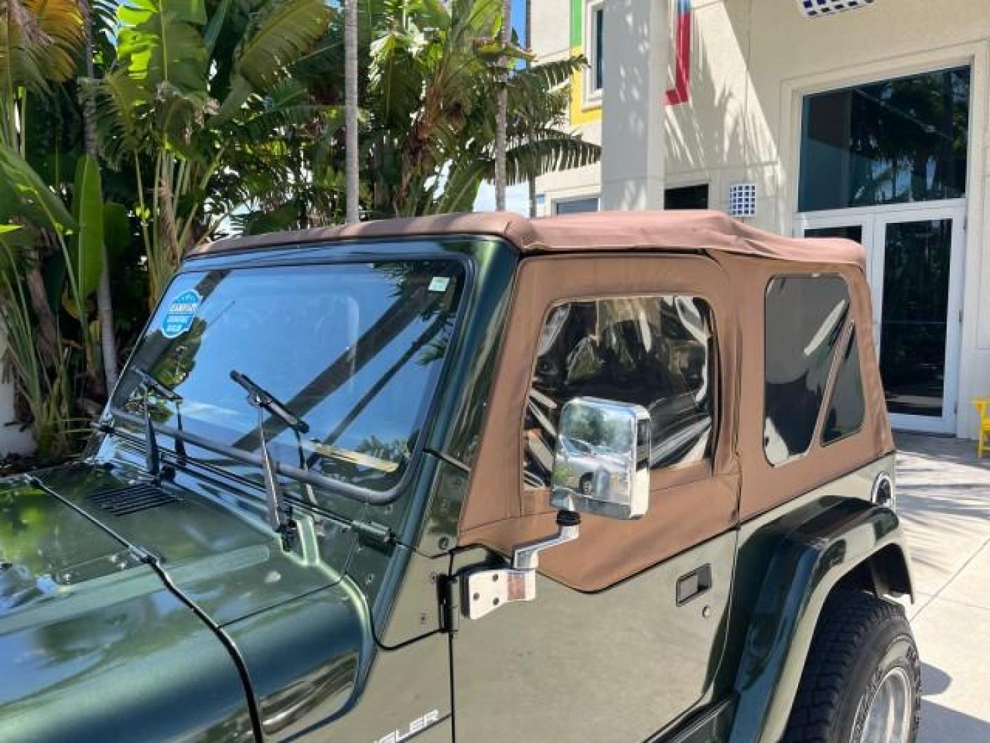 1998 Moss Green (PC) /Saddle Jeep Wrangler Sahara AUTO AC LOW MILES 60,233 (1J4FY49S2WP) with an 4.0L SMPI I6 Power Tech Engine engine, Automatic transmission, located at 4701 North Dixie Hwy, Pompano Beach, FL, 33064, (954) 422-2889, 26.240938, -80.123474 - OUR WEBPAGE FLORIDACARS1.COM HAS OVER 100 PHOTOS AND FREE CARFAX LINK 1998 JEEP WRANGLER SAHARA ROAD READY 4.0L I6 VIN: 1J4FY49S2WP723583 NO RECALLS 4X4 UTILITY (BLAZER, JIMMY, SCOUT, ETC.) LOW MILES 60,233 4.0L I6 F OHV FLORIDA OWNER GASOLINE CONVERTIBLE SOFT TOP REAR WHEEL DRIVE W/ 4X4 4X4 6 SERVI - Photo#81