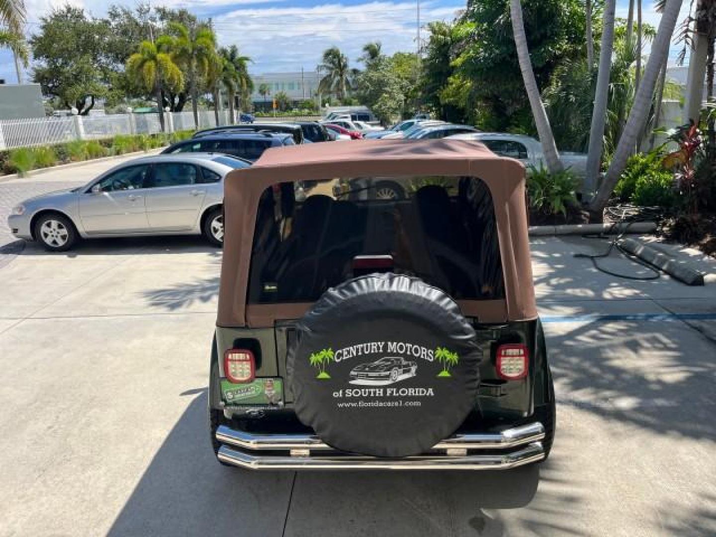 1998 Moss Green (PC) /Saddle Jeep Wrangler Sahara AUTO AC LOW MILES 60,233 (1J4FY49S2WP) with an 4.0L SMPI I6 Power Tech Engine engine, Automatic transmission, located at 4701 North Dixie Hwy, Pompano Beach, FL, 33064, (954) 422-2889, 26.240938, -80.123474 - OUR WEBPAGE FLORIDACARS1.COM HAS OVER 100 PHOTOS AND FREE CARFAX LINK 1998 JEEP WRANGLER SAHARA ROAD READY 4.0L I6 VIN: 1J4FY49S2WP723583 NO RECALLS 4X4 UTILITY (BLAZER, JIMMY, SCOUT, ETC.) LOW MILES 60,233 4.0L I6 F OHV FLORIDA OWNER GASOLINE CONVERTIBLE SOFT TOP REAR WHEEL DRIVE W/ 4X4 4X4 6 SERVI - Photo#96