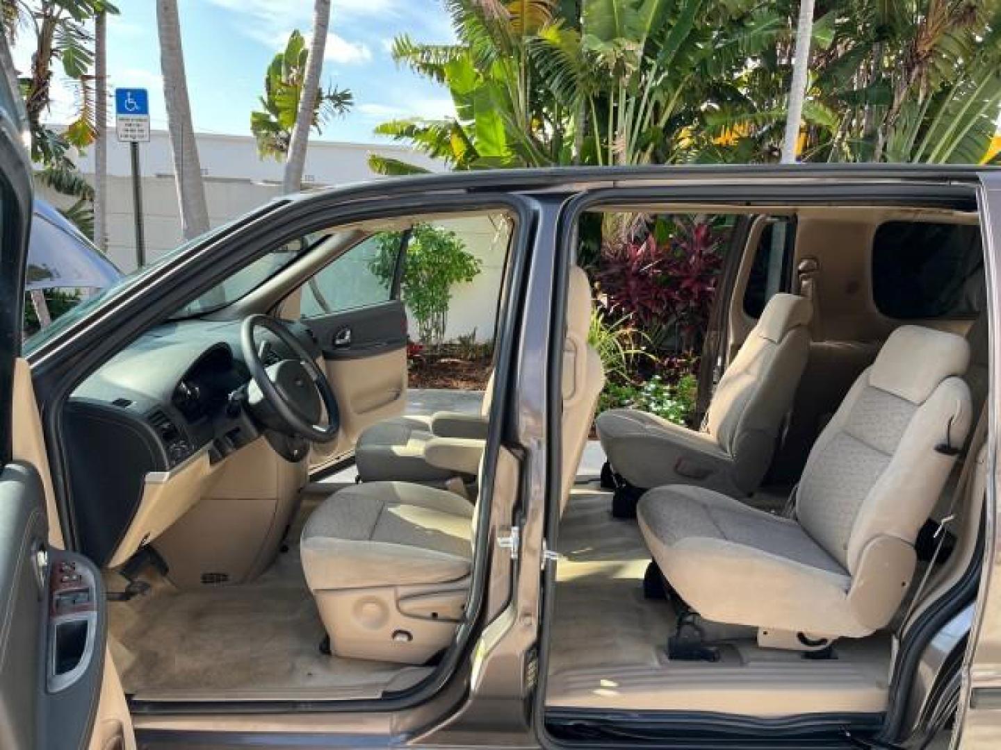 2008 Desert Brown Metallic /Cashmere Chevrolet Uplander VAN LS LOW MILES 47,919 (1GNDV23168D) with an 3.9L V6 SFI Engine engine, Automatic transmission, located at 4701 North Dixie Hwy, Pompano Beach, FL, 33064, (954) 422-2889, 26.240938, -80.123474 - OUR WEBPAGE FLORIDACARS1.COM HAS OVER 100 PHOTOS AND FREE CARFAX LINK 2008 CHEVROLET UPLANDER LS ROAD READY 3.9L V6 VIN: 1GNDV23168D130721 NO ACCIDENTS VAN NO RECALLS 25 MPG 3.9L V6 F LOW MILES 47,919 GASOLINE 3 ROW SEATS FRONT WHEEL DRIVE POWER SEATS/MIRRORS 12 SERVICE RECORDS Anti-Theft System Con - Photo#10