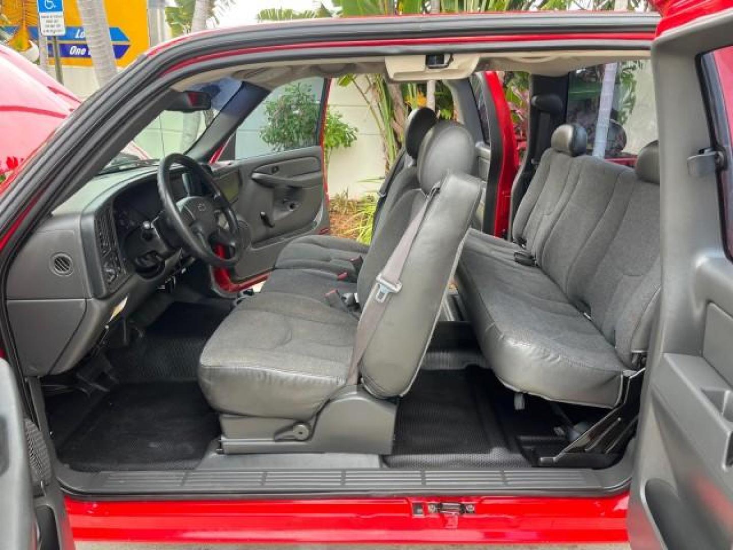 2005 Sport Red Metallic /Medium Gray Chevrolet Silverado 1500 4 DR LOW MILES 79,987 (1GCEC19X25Z) with an 4.3L Vortec 4300 V6 MFI Engine engine, Automatic transmission, located at 4701 North Dixie Hwy, Pompano Beach, FL, 33064, (954) 422-2889, 26.240938, -80.123474 - OUR WEBPAGE FLORIDACARS1.COM HAS OVER 100 PHOTOS AND FREE CARFAX LINK 2005 CHEVROLET SILVERADO 1500 ROAD READY WORK READY VIN: 1GCEC19X25Z205566 NO ACCIDENTS 6,6 FT BED 4 DOOR EXTENDED CAB PICKUP NO RECALLS 4.3L V6 4.3L V6 F FLORIDA OWNER GASOLINE BLUETOOTH LOW MILES 79,987 REAR WHEEL DRIVE BACK UP - Photo#10