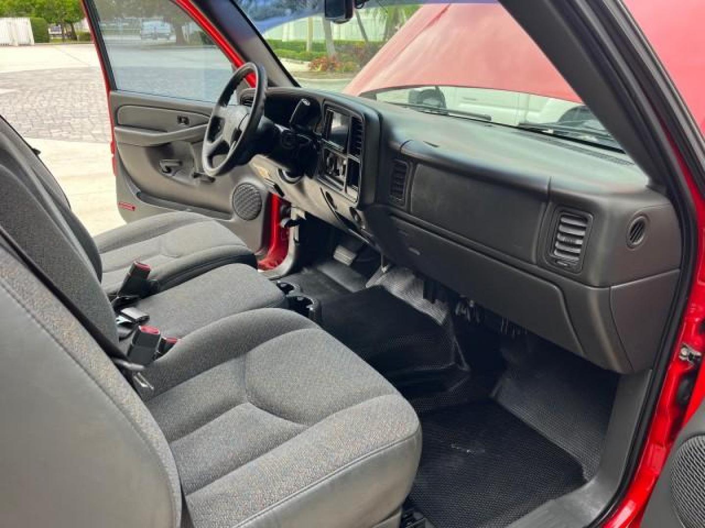 2005 Sport Red Metallic /Medium Gray Chevrolet Silverado 1500 4 DR LOW MILES 79,987 (1GCEC19X25Z) with an 4.3L Vortec 4300 V6 MFI Engine engine, Automatic transmission, located at 4701 North Dixie Hwy, Pompano Beach, FL, 33064, (954) 422-2889, 26.240938, -80.123474 - OUR WEBPAGE FLORIDACARS1.COM HAS OVER 100 PHOTOS AND FREE CARFAX LINK 2005 CHEVROLET SILVERADO 1500 ROAD READY WORK READY VIN: 1GCEC19X25Z205566 NO ACCIDENTS 6,6 FT BED 4 DOOR EXTENDED CAB PICKUP NO RECALLS 4.3L V6 4.3L V6 F FLORIDA OWNER GASOLINE BLUETOOTH LOW MILES 79,987 REAR WHEEL DRIVE BACK UP - Photo#27