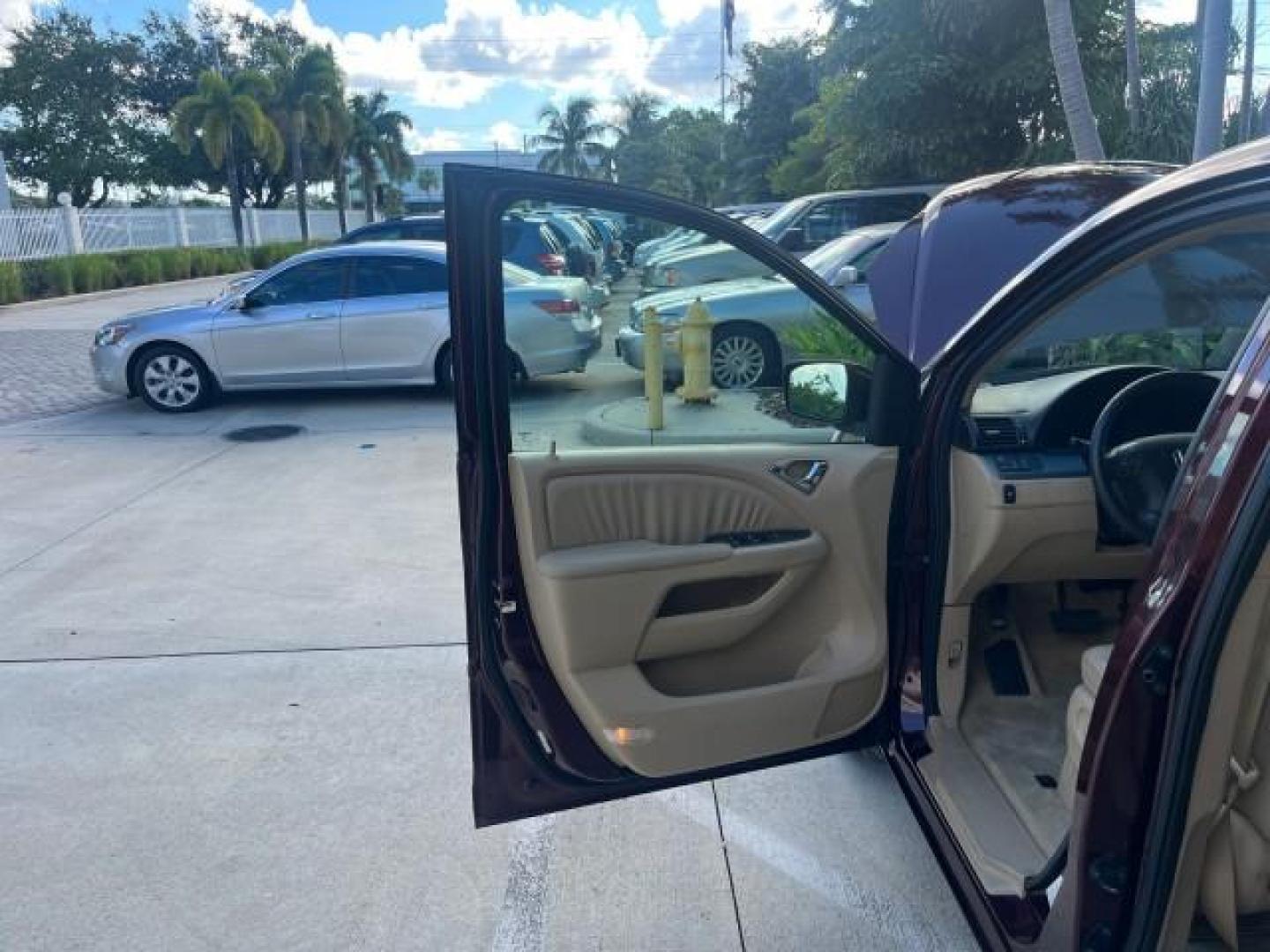 2007 Dark Cherry Pearl /Ivory Honda Odyssey SUNROOF NAV 1 FL EX-L LOW MILES 67,947 (5FNRL38627B) with an 3.5L SOHC MPFI 24-Valve i-VTEC V6 Engine engine, Automatic transmission, located at 4701 North Dixie Hwy, Pompano Beach, FL, 33064, (954) 422-2889, 26.240938, -80.123474 - OUR WEBPAGE FLORIDACARS1.COM HAS OVER 100 PHOTOS AND FREE CARFAX LINK 2007 HONDA ODYSSEY EX-L 26 MPG ROAD READY 3.5L V6 VIN: 5FNRL38627B442296 POWER SEATS NO ACCIDENTS NO RECALLS VAN LOW MILES 67,947 1 OWNER FLORIDA 3.5L V6 F SOHC 24V NAVIGATION POWER SLIDING DOORS GASOLINE BACK UP CAMERA POWER SUNR - Photo#9