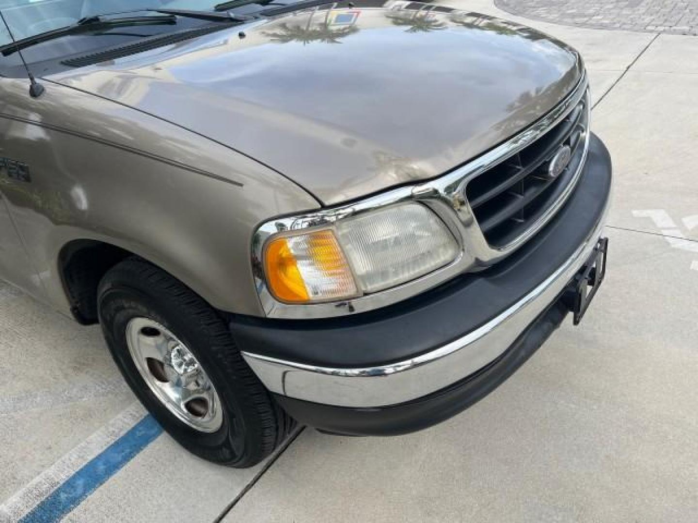 2001 Arizona Beige Metallic /Medium Graphite Ford F-150 XL PU LOW MILES 71,934 (1FTZF17251N) with an 4.2L SEFI V6 Engine engine, Automatic transmission, located at 4701 North Dixie Hwy, Pompano Beach, FL, 33064, (954) 422-2889, 26.240938, -80.123474 - OUR WEBPAGE FLORIDACARS1.COM HAS OVER 100 PHOTOS AND FREE CARFAX LINK 2001 FORD F-150 XL ROAD READY WORK READY PICKUP NO ACCIDENTS 4.2L V6 4.2L V6 F SOHC AUTO AC LOW MILES 71,934 GASOLINE 8 SERVICE RECORDS REAR WHEEL DRIVE 8.1 FT BED LENGTH XL Anti-Theft System Approach Lights RWD THIS IS ONE OF THE - Photo#77