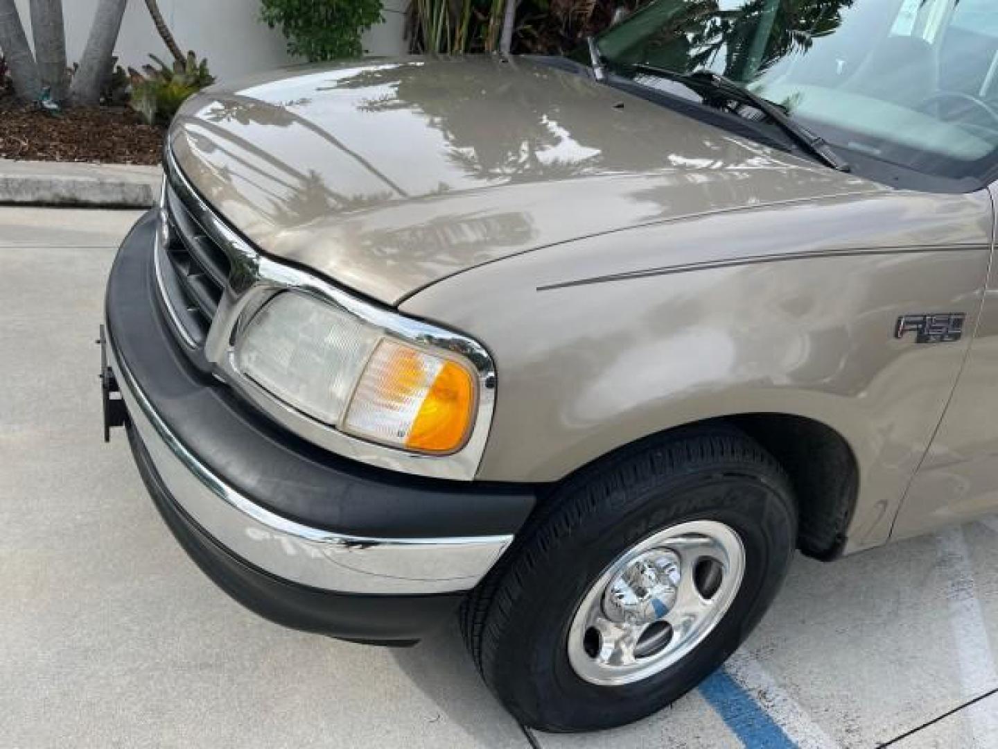 2001 Arizona Beige Metallic /Medium Graphite Ford F-150 XL PU LOW MILES 71,934 (1FTZF17251N) with an 4.2L SEFI V6 Engine engine, Automatic transmission, located at 4701 North Dixie Hwy, Pompano Beach, FL, 33064, (954) 422-2889, 26.240938, -80.123474 - OUR WEBPAGE FLORIDACARS1.COM HAS OVER 100 PHOTOS AND FREE CARFAX LINK 2001 FORD F-150 XL ROAD READY WORK READY PICKUP NO ACCIDENTS 4.2L V6 4.2L V6 F SOHC AUTO AC LOW MILES 71,934 GASOLINE 8 SERVICE RECORDS REAR WHEEL DRIVE 8.1 FT BED LENGTH XL Anti-Theft System Approach Lights RWD THIS IS ONE OF THE - Photo#78