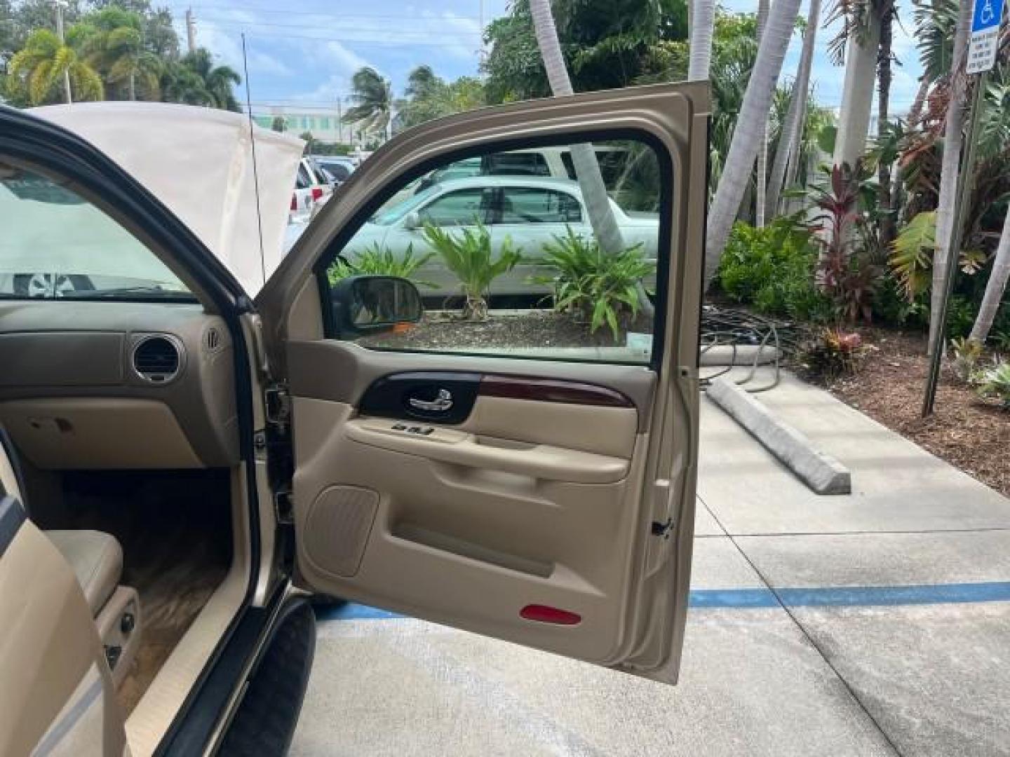 2004 Sand Beige Metallic /Light Tan GMC Envoy 4WD SLE LOW MILES 85,903 (1GKDT13S442) with an 4.2L Vortec 4200 SFI I6 Engine engine, Automatic transmission, located at 4701 North Dixie Hwy, Pompano Beach, FL, 33064, (954) 422-2889, 26.240938, -80.123474 - OUR WEBPAGE FLORIDACARS1.COM HAS OVER 100 PHOTOS AND FREE CARFAX LINK 2004 GMC ENVOY SLE ROAD READY 4.2L V6 VIN: 1GKDT13S442273596 NO ACCIDENTS AWD DOOR WAGON/SPORT UTILITY NO RECALLS 4X4 4.2L V6 F POWER LEATHER SEATS GASOLINE LOW MILES 85,903 POWER SUNROOF REAR WHEEL DRIVE W/ 4X4 ON DEMAND AWD 34 S - Photo#11