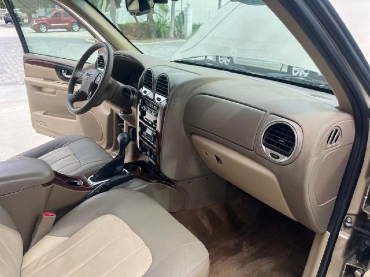 2004 Sand Beige Metallic /Light Tan GMC Envoy 4WD SLE LOW MILES 85,903 (1GKDT13S442) with an 4.2L Vortec 4200 SFI I6 Engine engine, Automatic transmission, located at 4701 North Dixie Hwy, Pompano Beach, FL, 33064, (954) 422-2889, 26.240938, -80.123474 - OUR WEBPAGE FLORIDACARS1.COM HAS OVER 100 PHOTOS AND FREE CARFAX LINK 2004 GMC ENVOY SLE ROAD READY 4.2L V6 VIN: 1GKDT13S442273596 NO ACCIDENTS AWD DOOR WAGON/SPORT UTILITY NO RECALLS 4X4 4.2L V6 F POWER LEATHER SEATS GASOLINE LOW MILES 85,903 POWER SUNROOF REAR WHEEL DRIVE W/ 4X4 ON DEMAND AWD 34 S - Photo#28