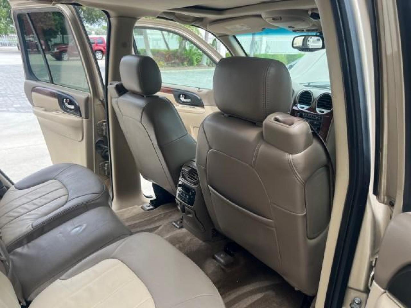 2004 Sand Beige Metallic /Light Tan GMC Envoy 4WD SLE LOW MILES 85,903 (1GKDT13S442) with an 4.2L Vortec 4200 SFI I6 Engine engine, Automatic transmission, located at 4701 North Dixie Hwy, Pompano Beach, FL, 33064, (954) 422-2889, 26.240938, -80.123474 - OUR WEBPAGE FLORIDACARS1.COM HAS OVER 100 PHOTOS AND FREE CARFAX LINK 2004 GMC ENVOY SLE ROAD READY 4.2L V6 VIN: 1GKDT13S442273596 NO ACCIDENTS AWD DOOR WAGON/SPORT UTILITY NO RECALLS 4X4 4.2L V6 F POWER LEATHER SEATS GASOLINE LOW MILES 85,903 POWER SUNROOF REAR WHEEL DRIVE W/ 4X4 ON DEMAND AWD 34 S - Photo#31