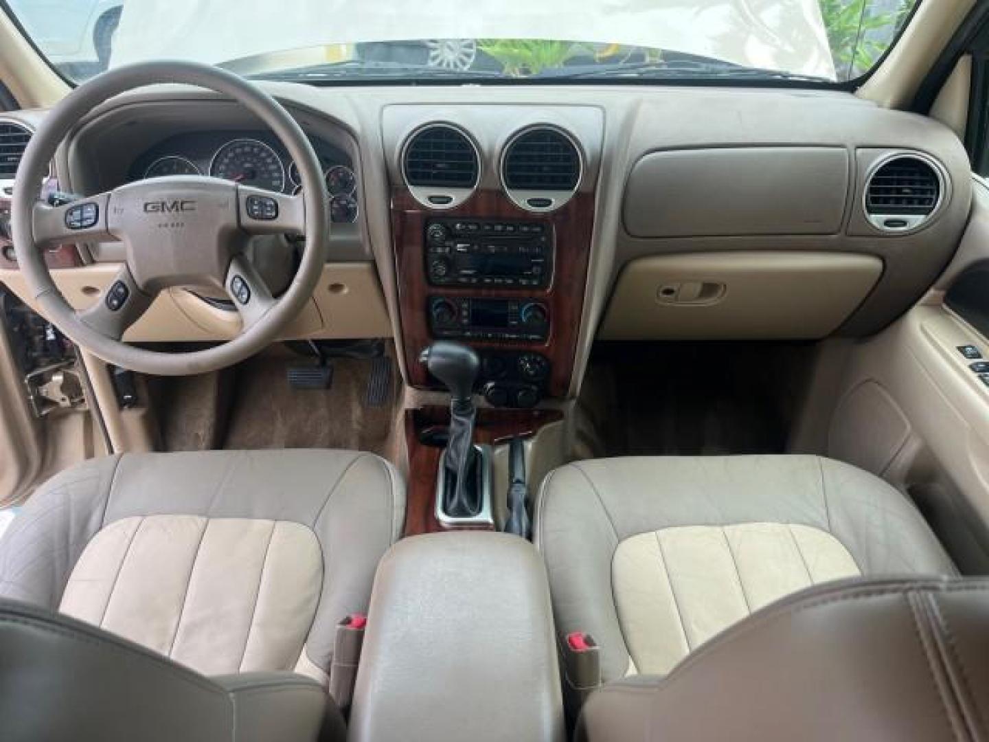 2004 Sand Beige Metallic /Light Tan GMC Envoy 4WD SLE LOW MILES 85,903 (1GKDT13S442) with an 4.2L Vortec 4200 SFI I6 Engine engine, Automatic transmission, located at 4701 North Dixie Hwy, Pompano Beach, FL, 33064, (954) 422-2889, 26.240938, -80.123474 - OUR WEBPAGE FLORIDACARS1.COM HAS OVER 100 PHOTOS AND FREE CARFAX LINK 2004 GMC ENVOY SLE ROAD READY 4.2L V6 VIN: 1GKDT13S442273596 NO ACCIDENTS AWD DOOR WAGON/SPORT UTILITY NO RECALLS 4X4 4.2L V6 F POWER LEATHER SEATS GASOLINE LOW MILES 85,903 POWER SUNROOF REAR WHEEL DRIVE W/ 4X4 ON DEMAND AWD 34 S - Photo#34