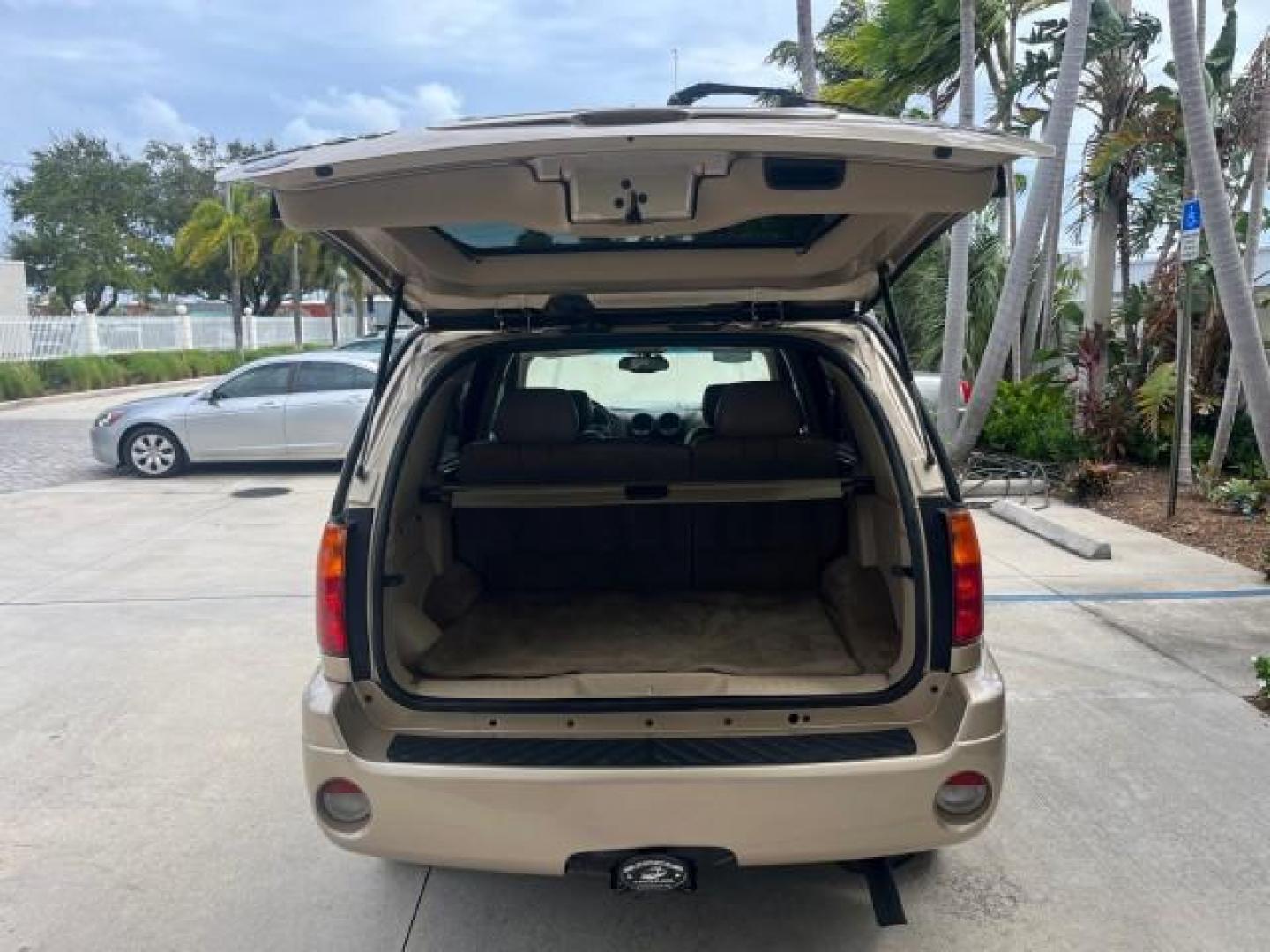 2004 Sand Beige Metallic /Light Tan GMC Envoy 4WD SLE LOW MILES 85,903 (1GKDT13S442) with an 4.2L Vortec 4200 SFI I6 Engine engine, Automatic transmission, located at 4701 North Dixie Hwy, Pompano Beach, FL, 33064, (954) 422-2889, 26.240938, -80.123474 - OUR WEBPAGE FLORIDACARS1.COM HAS OVER 100 PHOTOS AND FREE CARFAX LINK 2004 GMC ENVOY SLE ROAD READY 4.2L V6 VIN: 1GKDT13S442273596 NO ACCIDENTS AWD DOOR WAGON/SPORT UTILITY NO RECALLS 4X4 4.2L V6 F POWER LEATHER SEATS GASOLINE LOW MILES 85,903 POWER SUNROOF REAR WHEEL DRIVE W/ 4X4 ON DEMAND AWD 34 S - Photo#65