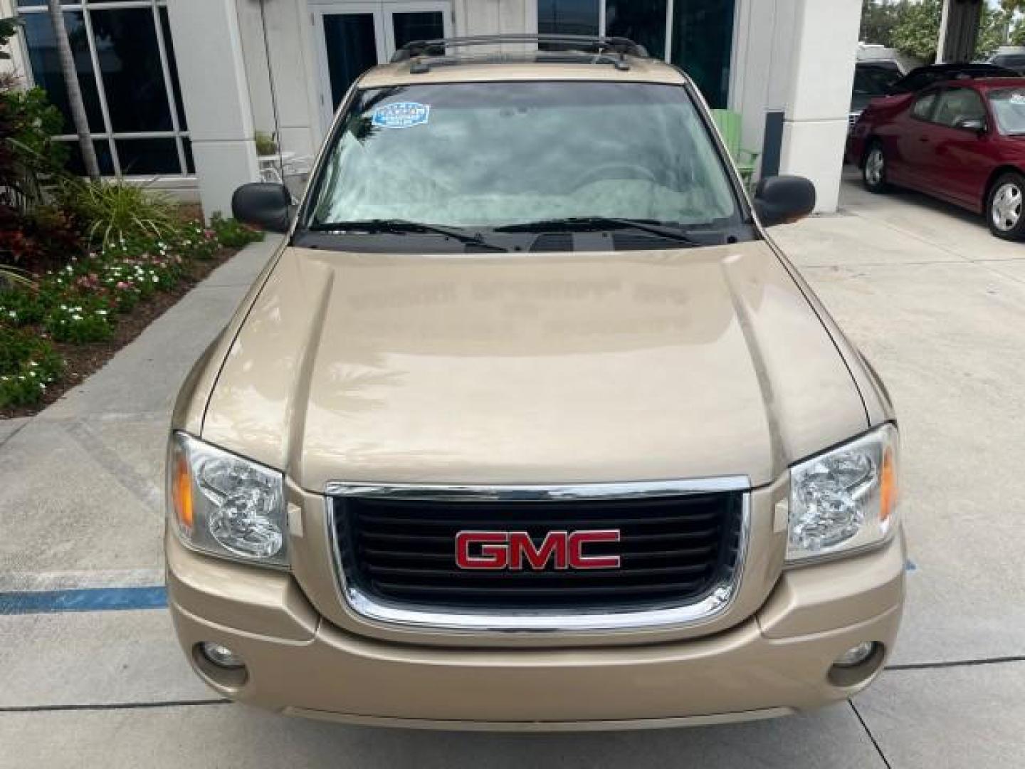 2004 Sand Beige Metallic /Light Tan GMC Envoy 4WD SLE LOW MILES 85,903 (1GKDT13S442) with an 4.2L Vortec 4200 SFI I6 Engine engine, Automatic transmission, located at 4701 North Dixie Hwy, Pompano Beach, FL, 33064, (954) 422-2889, 26.240938, -80.123474 - OUR WEBPAGE FLORIDACARS1.COM HAS OVER 100 PHOTOS AND FREE CARFAX LINK 2004 GMC ENVOY SLE ROAD READY 4.2L V6 VIN: 1GKDT13S442273596 NO ACCIDENTS AWD DOOR WAGON/SPORT UTILITY NO RECALLS 4X4 4.2L V6 F POWER LEATHER SEATS GASOLINE LOW MILES 85,903 POWER SUNROOF REAR WHEEL DRIVE W/ 4X4 ON DEMAND AWD 34 S - Photo#85