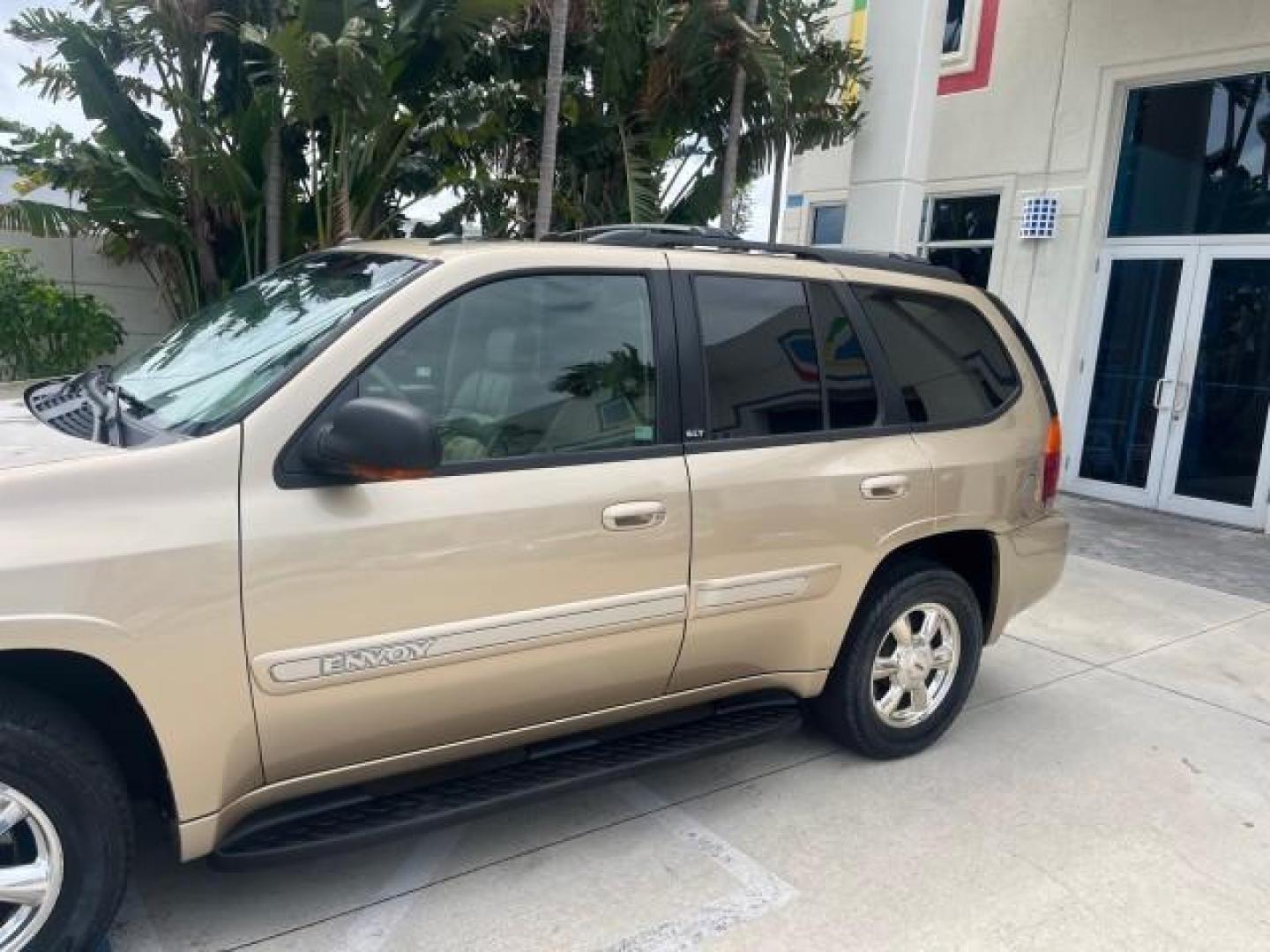 2004 Sand Beige Metallic /Light Tan GMC Envoy 4WD SLE LOW MILES 85,903 (1GKDT13S442) with an 4.2L Vortec 4200 SFI I6 Engine engine, Automatic transmission, located at 4701 North Dixie Hwy, Pompano Beach, FL, 33064, (954) 422-2889, 26.240938, -80.123474 - OUR WEBPAGE FLORIDACARS1.COM HAS OVER 100 PHOTOS AND FREE CARFAX LINK 2004 GMC ENVOY SLE ROAD READY 4.2L V6 VIN: 1GKDT13S442273596 NO ACCIDENTS AWD DOOR WAGON/SPORT UTILITY NO RECALLS 4X4 4.2L V6 F POWER LEATHER SEATS GASOLINE LOW MILES 85,903 POWER SUNROOF REAR WHEEL DRIVE W/ 4X4 ON DEMAND AWD 34 S - Photo#89