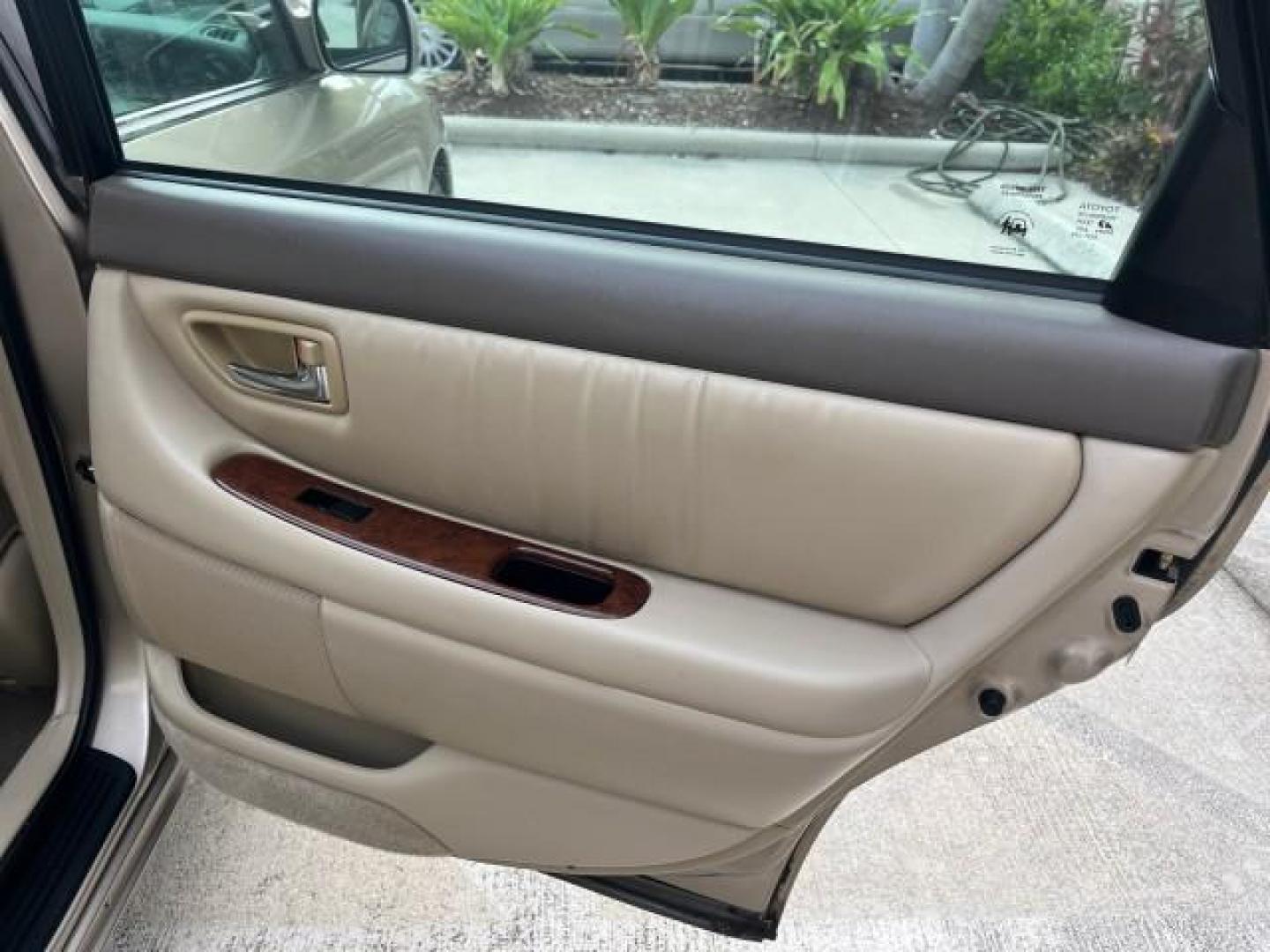 2003 Desert Sand Mica /Ivory Toyota Avalon XLS LOW MILES 72,511 (4T1BF28B73U) with an 3.0L DOHC MPFI 24-Valve V6 Engine engine, Automatic transmission, located at 4701 North Dixie Hwy, Pompano Beach, FL, 33064, (954) 422-2889, 26.240938, -80.123474 - OUR WEBPAGE FLORIDACARS1.COM HAS OVER 100 PHOTOS AND FREE CARFAX LINK 2003 TOYOTA AVALON XLS ROAD READY 3.0L V6 VIN: 4T1BF28B73U304119 NO RECALLS 29 MPG SEDAN 4 DR FLORIDA OWNER 3.0L V6 F DOHC 24V LOW MILES 72,511 GASOLINE POWER LEATHER SEATS FRONT WHEEL DRIVE 18 SERVICE RECORDS POWER SUNROOF XLE Al - Photo#28