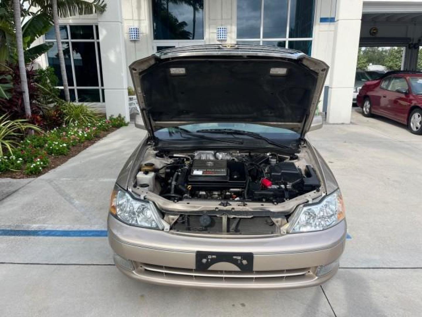 2003 Desert Sand Mica /Ivory Toyota Avalon XLS LOW MILES 72,511 (4T1BF28B73U) with an 3.0L DOHC MPFI 24-Valve V6 Engine engine, Automatic transmission, located at 4701 North Dixie Hwy, Pompano Beach, FL, 33064, (954) 422-2889, 26.240938, -80.123474 - OUR WEBPAGE FLORIDACARS1.COM HAS OVER 100 PHOTOS AND FREE CARFAX LINK 2003 TOYOTA AVALON XLS ROAD READY 3.0L V6 VIN: 4T1BF28B73U304119 NO RECALLS 29 MPG SEDAN 4 DR FLORIDA OWNER 3.0L V6 F DOHC 24V LOW MILES 72,511 GASOLINE POWER LEATHER SEATS FRONT WHEEL DRIVE 18 SERVICE RECORDS POWER SUNROOF XLE Al - Photo#73