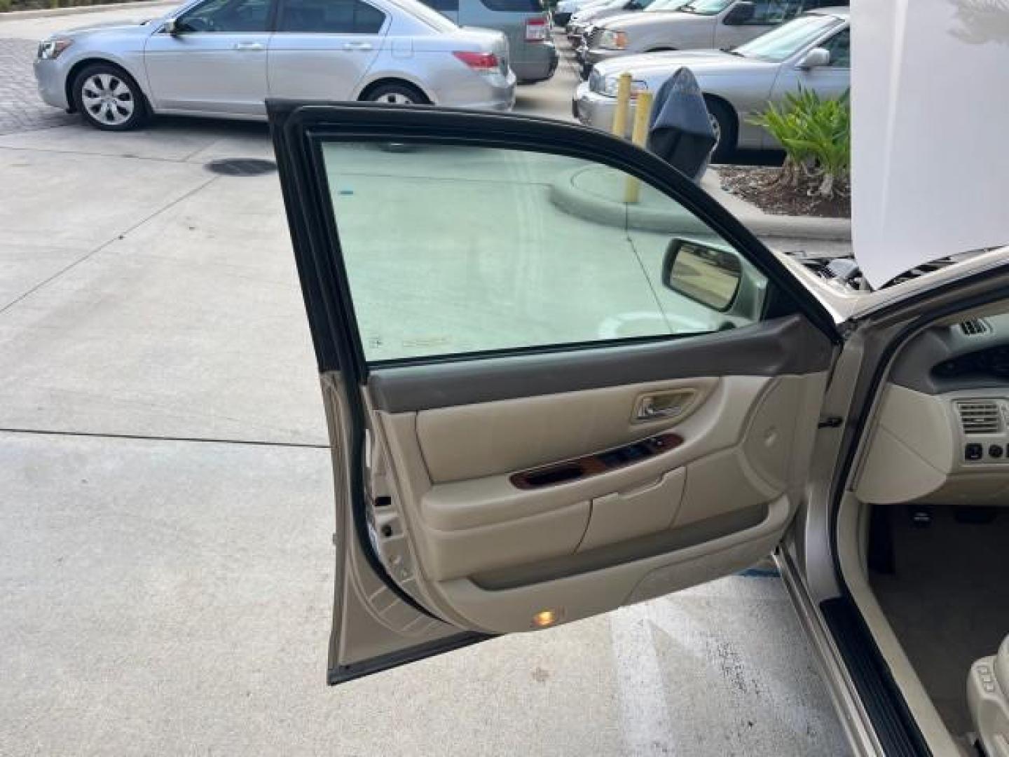 2003 Desert Sand Mica /Ivory Toyota Avalon XLS LOW MILES 72,511 (4T1BF28B73U) with an 3.0L DOHC MPFI 24-Valve V6 Engine engine, Automatic transmission, located at 4701 North Dixie Hwy, Pompano Beach, FL, 33064, (954) 422-2889, 26.240938, -80.123474 - OUR WEBPAGE FLORIDACARS1.COM HAS OVER 100 PHOTOS AND FREE CARFAX LINK 2003 TOYOTA AVALON XLS ROAD READY 3.0L V6 VIN: 4T1BF28B73U304119 NO RECALLS 29 MPG SEDAN 4 DR FLORIDA OWNER 3.0L V6 F DOHC 24V LOW MILES 72,511 GASOLINE POWER LEATHER SEATS FRONT WHEEL DRIVE 18 SERVICE RECORDS POWER SUNROOF XLE Al - Photo#9