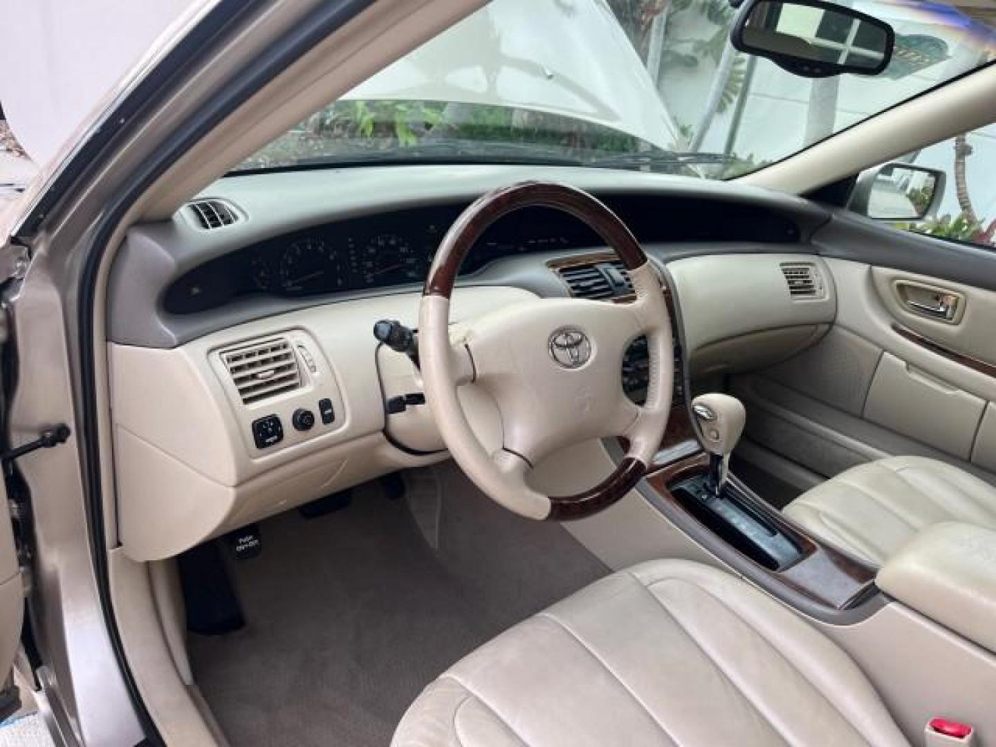 2003 Desert Sand Mica /Ivory Toyota Avalon XLS LOW MILES 72,511 (4T1BF28B73U) with an 3.0L DOHC MPFI 24-Valve V6 Engine engine, Automatic transmission, located at 4701 North Dixie Hwy, Pompano Beach, FL, 33064, (954) 422-2889, 26.240938, -80.123474 - OUR WEBPAGE FLORIDACARS1.COM HAS OVER 100 PHOTOS AND FREE CARFAX LINK 2003 TOYOTA AVALON XLS ROAD READY 3.0L V6 VIN: 4T1BF28B73U304119 NO RECALLS 29 MPG SEDAN 4 DR FLORIDA OWNER 3.0L V6 F DOHC 24V LOW MILES 72,511 GASOLINE POWER LEATHER SEATS FRONT WHEEL DRIVE 18 SERVICE RECORDS POWER SUNROOF XLE Al - Photo#43