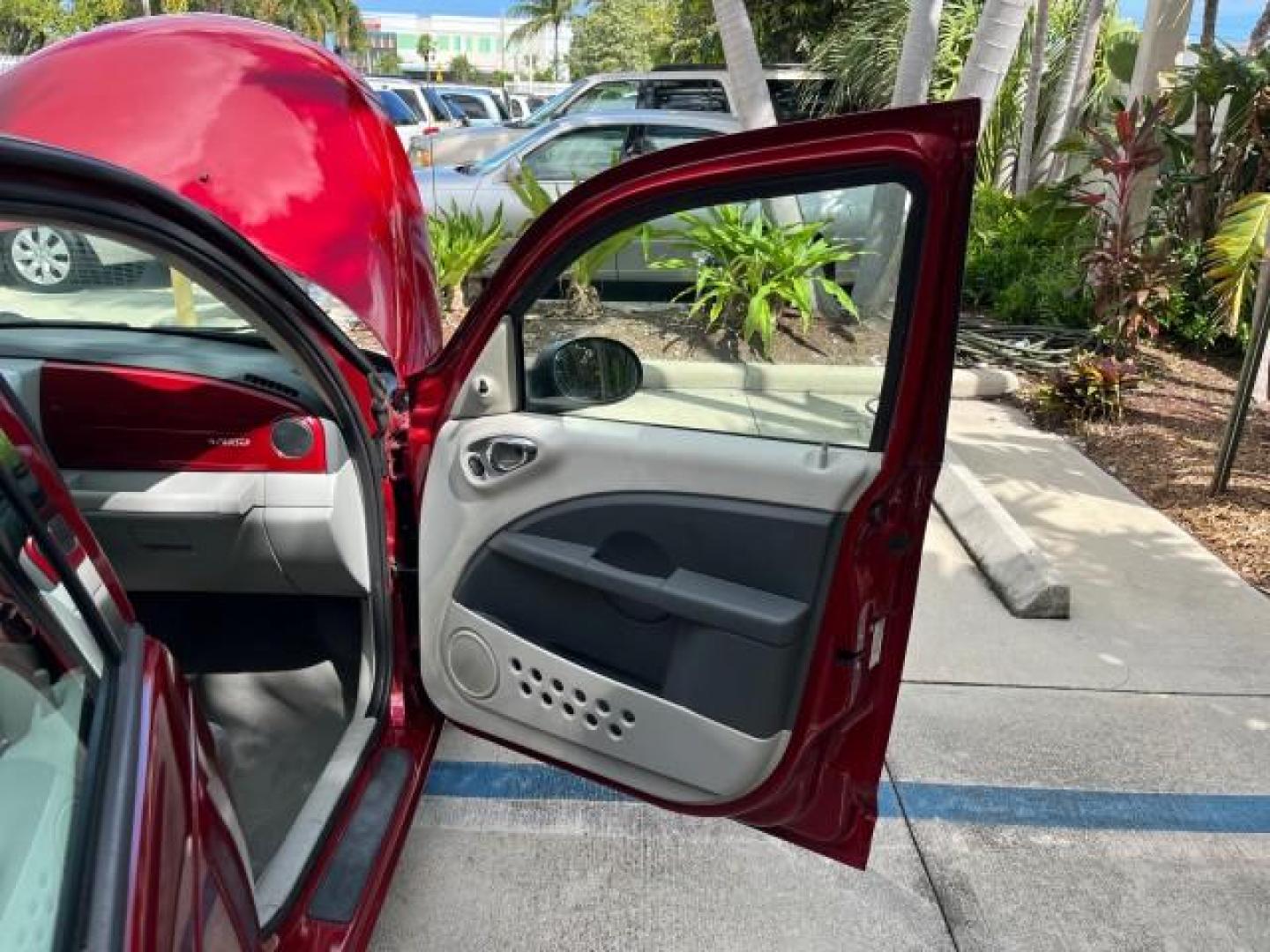 2009 Inferno Red Crystal Pearl /Pastel slate gray Chrysler PT Cruiser 1 FL LOW MILES 72,453 (3A8FY489X9T) with an 2.4L DOHC SMPI 16-Valve I4 Engine engine, Automatic transmission, located at 4701 North Dixie Hwy, Pompano Beach, FL, 33064, (954) 422-2889, 26.240938, -80.123474 - OUR WEBPAGE FLORIDACARS1.COM HAS OVER 100 PHOTOS AND FREE CARFAX LINK 2009 CHRYSLER PT CRUISER ROAD READY 2.4L I4 VIN: 3A8FY489X9T557035 NO RECALLS 26 MPG VAN 1 OWNER FLORIDA 2.4L I4 F DOHC 16V LOW MILES 72,453 GASOLINE 5 SERVICE RECORDS FRONT WHEEL DRIVE Additional Airbags Alloy Wheels Anti-Theft S - Photo#11