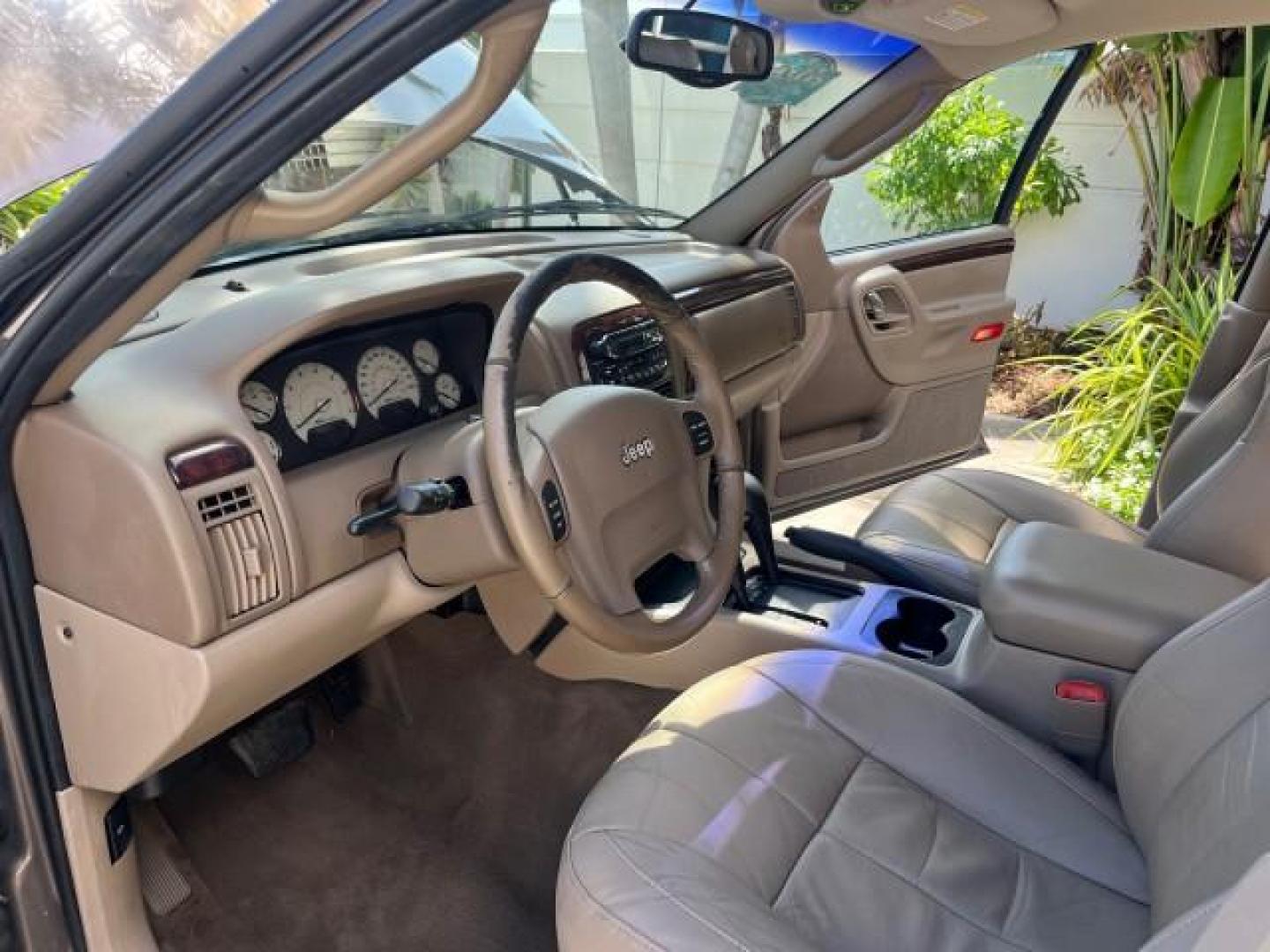 2002 Graphite Metallic /Dark Slate Gray Jeep Grand Cherokee 4WD V 8 Limited LOW MILES 78,358 (1J4GW58N42C) with an 4.7L SOHC SMFI V8 Power Tech Engine engine, Automatic transmission, located at 4701 North Dixie Hwy, Pompano Beach, FL, 33064, (954) 422-2889, 26.240938, -80.123474 - OUR WEBPAGE FLORIDACARS1.COM HAS OVER 100 PHOTOS AND FREE CARFAX LINK 2002 JEEP GRAND CHEROKEE LIMITED ROAD READY 4.7L V8 VIN: 1J4GW58N42C253456 NO ACCIDENTS 4WD 4X4 4 DOOR WAGON/SPORT UTILITY NO RECALLS LIMITED 4.7L V8 F SOHC TOW PKG POWER LEATHER SEATS GASOLINE POWER SUNROOF REAR WHEEL DRIVE W/ 4X - Photo#10