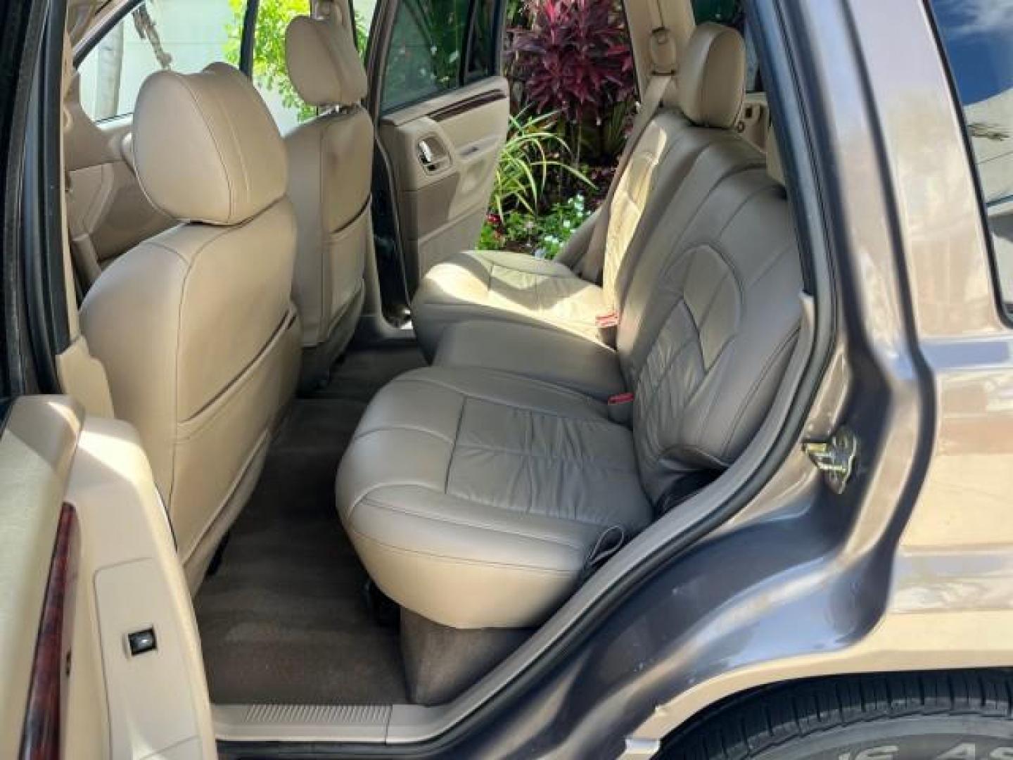 2002 Graphite Metallic /Dark Slate Gray Jeep Grand Cherokee 4WD V 8 Limited LOW MILES 78,358 (1J4GW58N42C) with an 4.7L SOHC SMFI V8 Power Tech Engine engine, Automatic transmission, located at 4701 North Dixie Hwy, Pompano Beach, FL, 33064, (954) 422-2889, 26.240938, -80.123474 - OUR WEBPAGE FLORIDACARS1.COM HAS OVER 100 PHOTOS AND FREE CARFAX LINK 2002 JEEP GRAND CHEROKEE LIMITED ROAD READY 4.7L V8 VIN: 1J4GW58N42C253456 NO ACCIDENTS 4WD 4X4 4 DOOR WAGON/SPORT UTILITY NO RECALLS LIMITED 4.7L V8 F SOHC TOW PKG POWER LEATHER SEATS GASOLINE POWER SUNROOF REAR WHEEL DRIVE W/ 4X - Photo#14