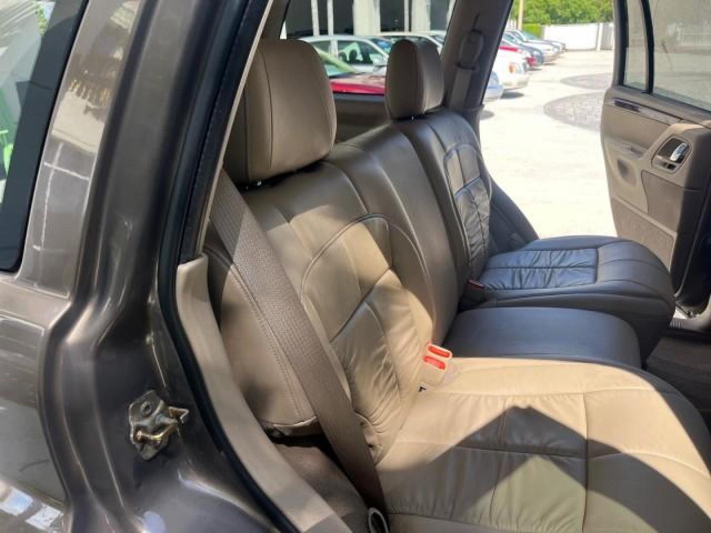 2002 Graphite Metallic /Dark Slate Gray Jeep Grand Cherokee 4WD V 8 Limited LOW MILES 78,358 (1J4GW58N42C) with an 4.7L SOHC SMFI V8 Power Tech Engine engine, Automatic transmission, located at 4701 North Dixie Hwy, Pompano Beach, FL, 33064, (954) 422-2889, 26.240938, -80.123474 - OUR WEBPAGE FLORIDACARS1.COM HAS OVER 100 PHOTOS AND FREE CARFAX LINK 2002 JEEP GRAND CHEROKEE LIMITED ROAD READY 4.7L V8 VIN: 1J4GW58N42C253456 NO ACCIDENTS 4WD 4X4 4 DOOR WAGON/SPORT UTILITY NO RECALLS LIMITED 4.7L V8 F SOHC TOW PKG POWER LEATHER SEATS GASOLINE POWER SUNROOF REAR WHEEL DRIVE W/ 4X - Photo#32