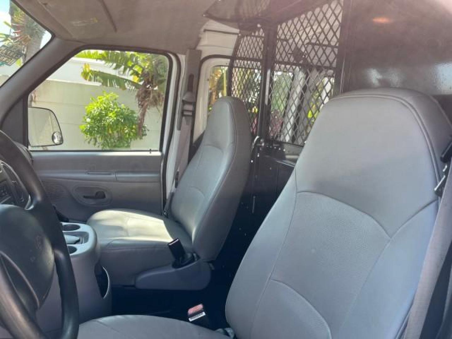 2000 Oxford White /Medium Graphite Ford Econoline Cargo Van LOW MILES 56,367 (1FTRE1427YH) with an 4.2L SEFI SPI V6 Engine engine, Automatic transmission, located at 4701 North Dixie Hwy, Pompano Beach, FL, 33064, (954) 422-2889, 26.240938, -80.123474 - OUR WEBPAGE FLORIDACARS1.COM HAS OVER 100 PHOTOS AND FREE CARFAX LINK 2000 FORD E-150 ROAD READY WORK READY VIN: 1FTRE1427YHB14150 NO ACCIDENTS NO RECALLS VAN 1 OWNER 4.2L V6 4.2L V6 F SOHC LOW MILES 56,367 GASOLINE REAR WHEEL DRIVE Approach Lights Front Bucket Seats RWD THIS IS ONE OF THE NICEST FO - Photo#45