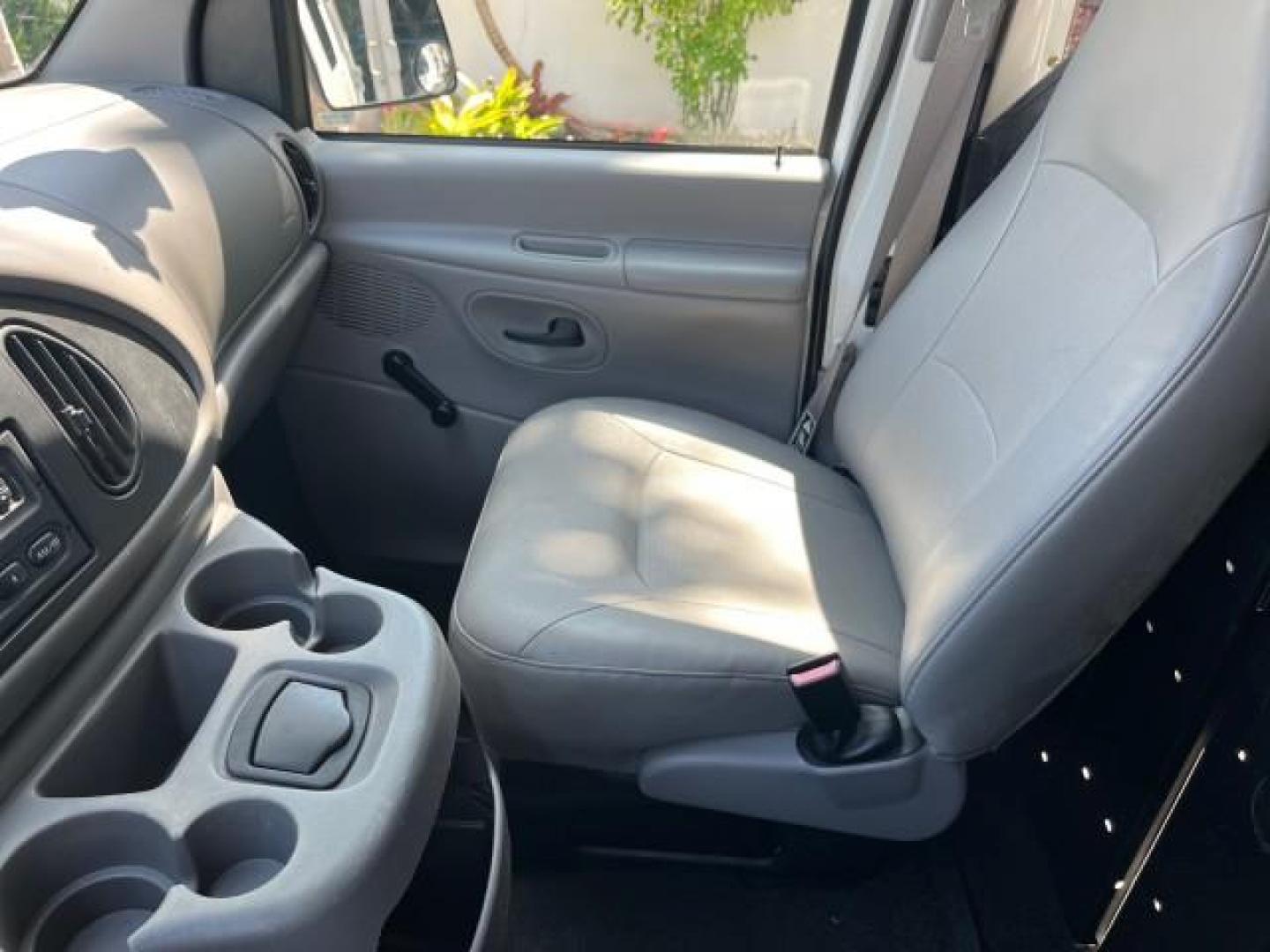 2000 Oxford White /Medium Graphite Ford Econoline Cargo Van LOW MILES 56,367 (1FTRE1427YH) with an 4.2L SEFI SPI V6 Engine engine, Automatic transmission, located at 4701 North Dixie Hwy, Pompano Beach, FL, 33064, (954) 422-2889, 26.240938, -80.123474 - OUR WEBPAGE FLORIDACARS1.COM HAS OVER 100 PHOTOS AND FREE CARFAX LINK 2000 FORD E-150 ROAD READY WORK READY VIN: 1FTRE1427YHB14150 NO ACCIDENTS NO RECALLS VAN 1 OWNER 4.2L V6 4.2L V6 F SOHC LOW MILES 56,367 GASOLINE REAR WHEEL DRIVE Approach Lights Front Bucket Seats RWD THIS IS ONE OF THE NICEST FO - Photo#49