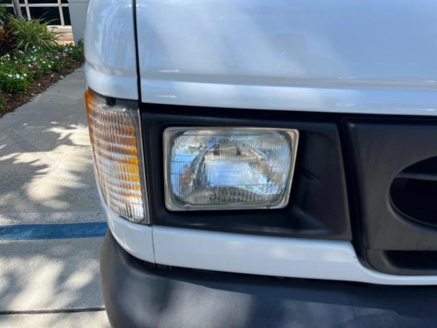 2000 Oxford White /Medium Graphite Ford Econoline Cargo Van LOW MILES 56,367 (1FTRE1427YH) with an 4.2L SEFI SPI V6 Engine engine, Automatic transmission, located at 4701 North Dixie Hwy, Pompano Beach, FL, 33064, (954) 422-2889, 26.240938, -80.123474 - OUR WEBPAGE FLORIDACARS1.COM HAS OVER 100 PHOTOS AND FREE CARFAX LINK 2000 FORD E-150 ROAD READY WORK READY VIN: 1FTRE1427YHB14150 NO ACCIDENTS NO RECALLS VAN 1 OWNER 4.2L V6 4.2L V6 F SOHC LOW MILES 56,367 GASOLINE REAR WHEEL DRIVE Approach Lights Front Bucket Seats RWD THIS IS ONE OF THE NICEST FO - Photo#79