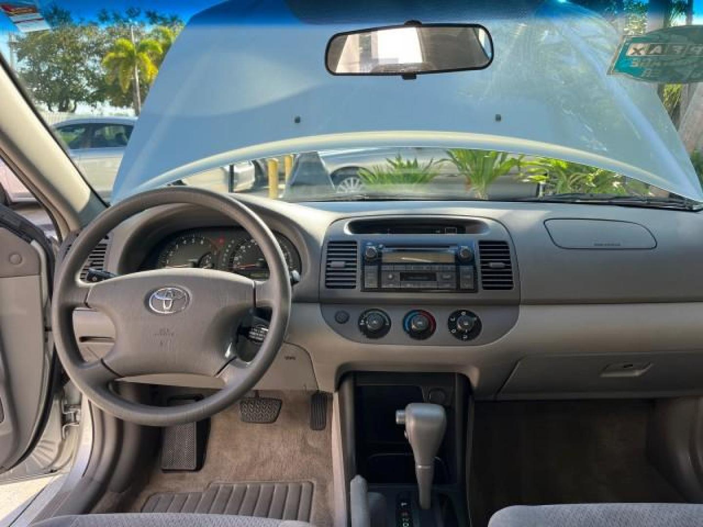 2004 Lunar Mist Metallic /Charcoal/Taupe Toyota Camry LE LOW MILES 74,675 (JTDBE32K840) with an 2.4L DOHC MPFI Vvti 16-Valve 4-Cyl Engine engine, Automatic transmission, located at 4701 North Dixie Hwy, Pompano Beach, FL, 33064, (954) 422-2889, 26.240938, -80.123474 - OUR WEBPAGE FLORIDACARS1.COM HAS OVER 100 PHOTOS AND FREE CARFAX LINK 2004 TOYOTA CAMRY LE ROAD READY 2.4L I4 VIN: JTDBE32K840300594 NO ACCIDENTS 32 MPG SEDAN 4 DR NO RECALLS FLORIDA OWNER 2.4L I4 F DOHC 16V 12 SERVICE RECORDS FRONT WHEEL DRIVE LOW MILES 74,675 POWER SEATS/MIRRORS Approach Lights Cr - Photo#34