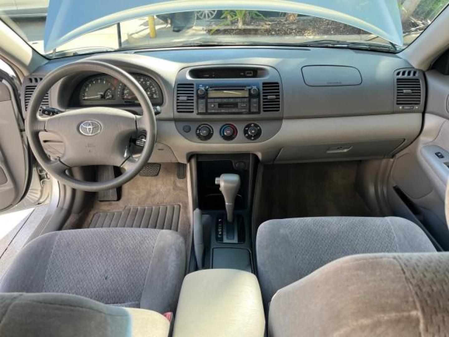 2004 Lunar Mist Metallic /Charcoal/Taupe Toyota Camry LE LOW MILES 74,675 (JTDBE32K840) with an 2.4L DOHC MPFI Vvti 16-Valve 4-Cyl Engine engine, Automatic transmission, located at 4701 North Dixie Hwy, Pompano Beach, FL, 33064, (954) 422-2889, 26.240938, -80.123474 - OUR WEBPAGE FLORIDACARS1.COM HAS OVER 100 PHOTOS AND FREE CARFAX LINK 2004 TOYOTA CAMRY LE ROAD READY 2.4L I4 VIN: JTDBE32K840300594 NO ACCIDENTS 32 MPG SEDAN 4 DR NO RECALLS FLORIDA OWNER 2.4L I4 F DOHC 16V 12 SERVICE RECORDS FRONT WHEEL DRIVE LOW MILES 74,675 POWER SEATS/MIRRORS Approach Lights Cr - Photo#36