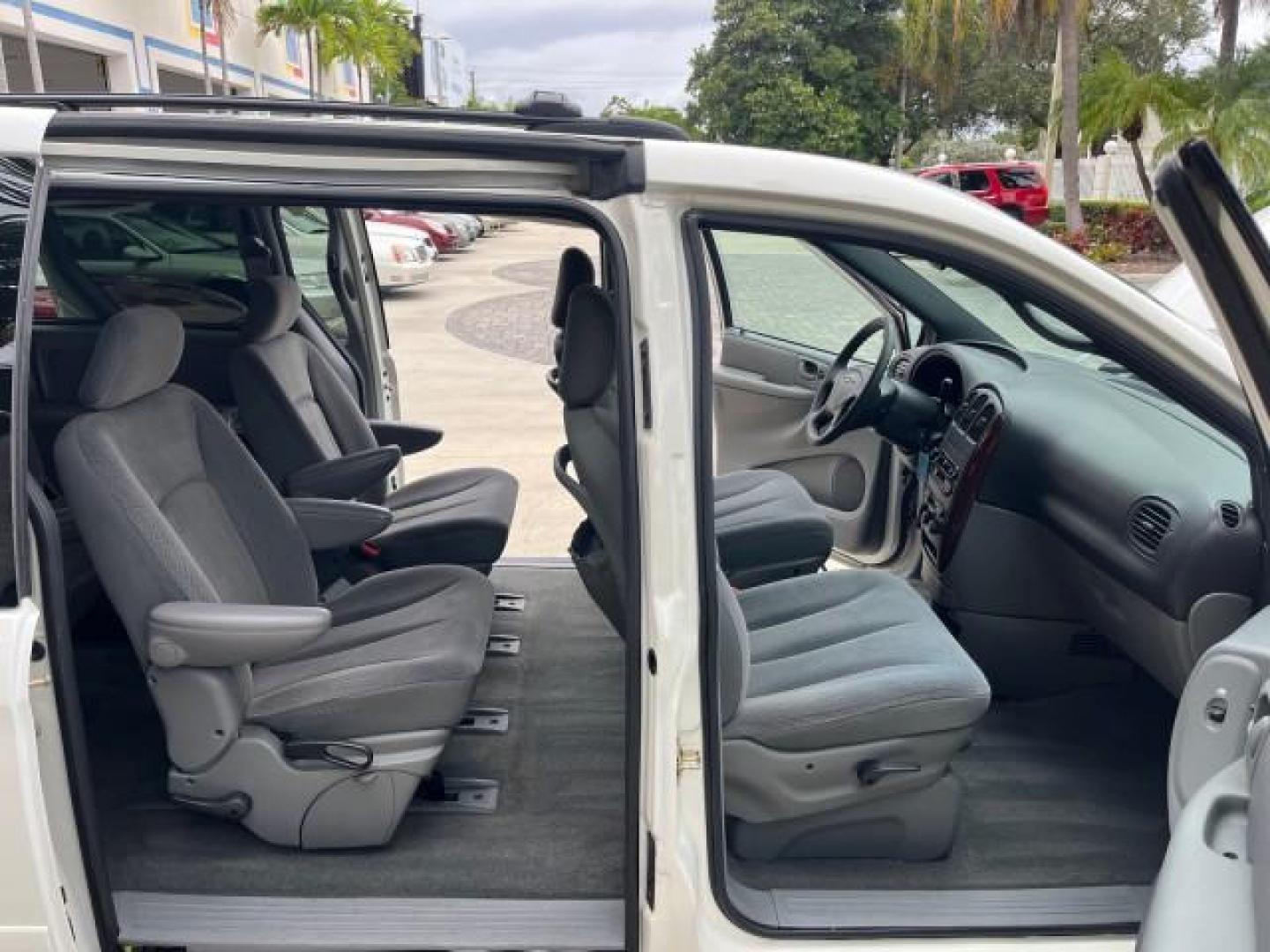 2004 Stone White /Med Slate Gray Chrysler Town and Country 1 FL LX LOW MILES 50,731 (2C4GP44R44R) with an 3.3L OHV V6 Engine engine, Automatic transmission, located at 4701 North Dixie Hwy, Pompano Beach, FL, 33064, (954) 422-2889, 26.240938, -80.123474 - OUR WEBPAGE FLORIDACARS1.COM HAS OVER 100 PHOTOS AND FREE CARFAX LINK 2004 CHRYSLER TOWN AND COUNTRY LX FAMILY VALUE ROAD READY 3.3L V6 VIN: 2C4GP44R44R594288 NO ACCIDENTS 26 MPG VAN NO RECALLS 3 ROW SEATS 3.3L V6 F 12V 11 SERVICE RECORDS GASOLINE 1 OWNER FLORIDA FRONT WHEEL DRIVE LOW MILES 50,731 A - Photo#12