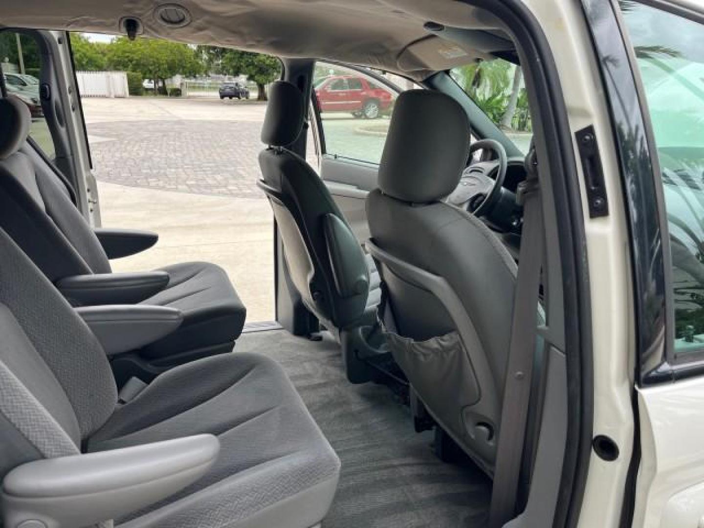 2004 Stone White /Med Slate Gray Chrysler Town and Country 1 FL LX LOW MILES 50,731 (2C4GP44R44R) with an 3.3L OHV V6 Engine engine, Automatic transmission, located at 4701 North Dixie Hwy, Pompano Beach, FL, 33064, (954) 422-2889, 26.240938, -80.123474 - OUR WEBPAGE FLORIDACARS1.COM HAS OVER 100 PHOTOS AND FREE CARFAX LINK 2004 CHRYSLER TOWN AND COUNTRY LX FAMILY VALUE ROAD READY 3.3L V6 VIN: 2C4GP44R44R594288 NO ACCIDENTS 26 MPG VAN NO RECALLS 3 ROW SEATS 3.3L V6 F 12V 11 SERVICE RECORDS GASOLINE 1 OWNER FLORIDA FRONT WHEEL DRIVE LOW MILES 50,731 A - Photo#30