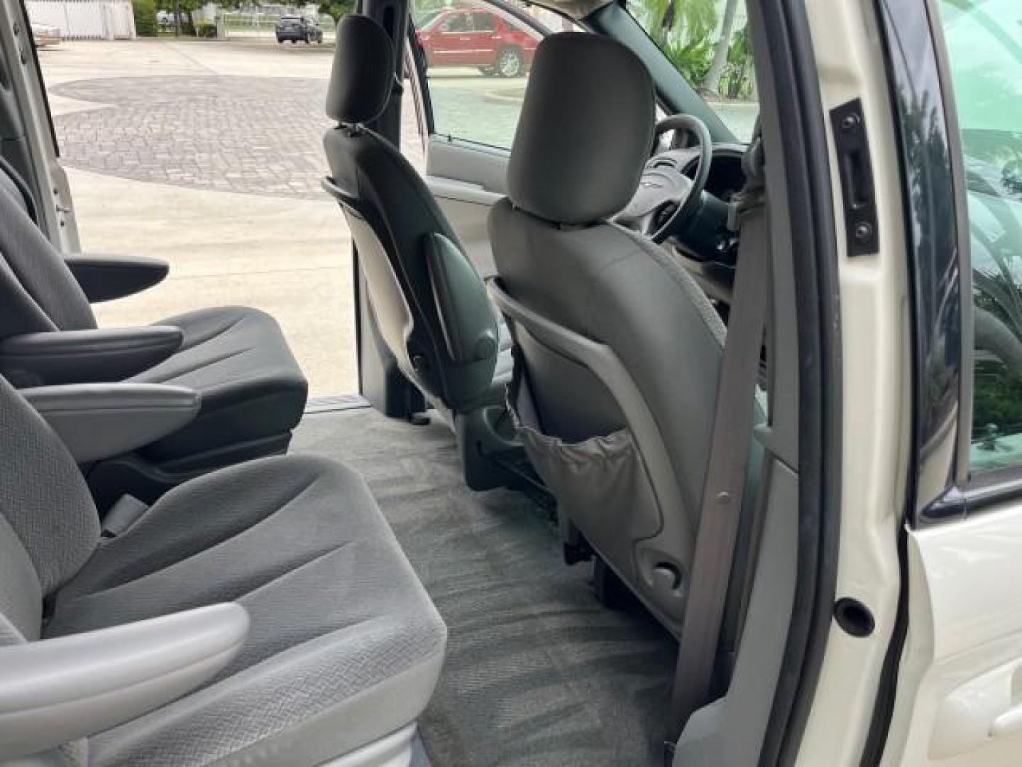 2004 Stone White /Med Slate Gray Chrysler Town and Country 1 FL LX LOW MILES 50,731 (2C4GP44R44R) with an 3.3L OHV V6 Engine engine, Automatic transmission, located at 4701 North Dixie Hwy, Pompano Beach, FL, 33064, (954) 422-2889, 26.240938, -80.123474 - OUR WEBPAGE FLORIDACARS1.COM HAS OVER 100 PHOTOS AND FREE CARFAX LINK 2004 CHRYSLER TOWN AND COUNTRY LX FAMILY VALUE ROAD READY 3.3L V6 VIN: 2C4GP44R44R594288 NO ACCIDENTS 26 MPG VAN NO RECALLS 3 ROW SEATS 3.3L V6 F 12V 11 SERVICE RECORDS GASOLINE 1 OWNER FLORIDA FRONT WHEEL DRIVE LOW MILES 50,731 A - Photo#31