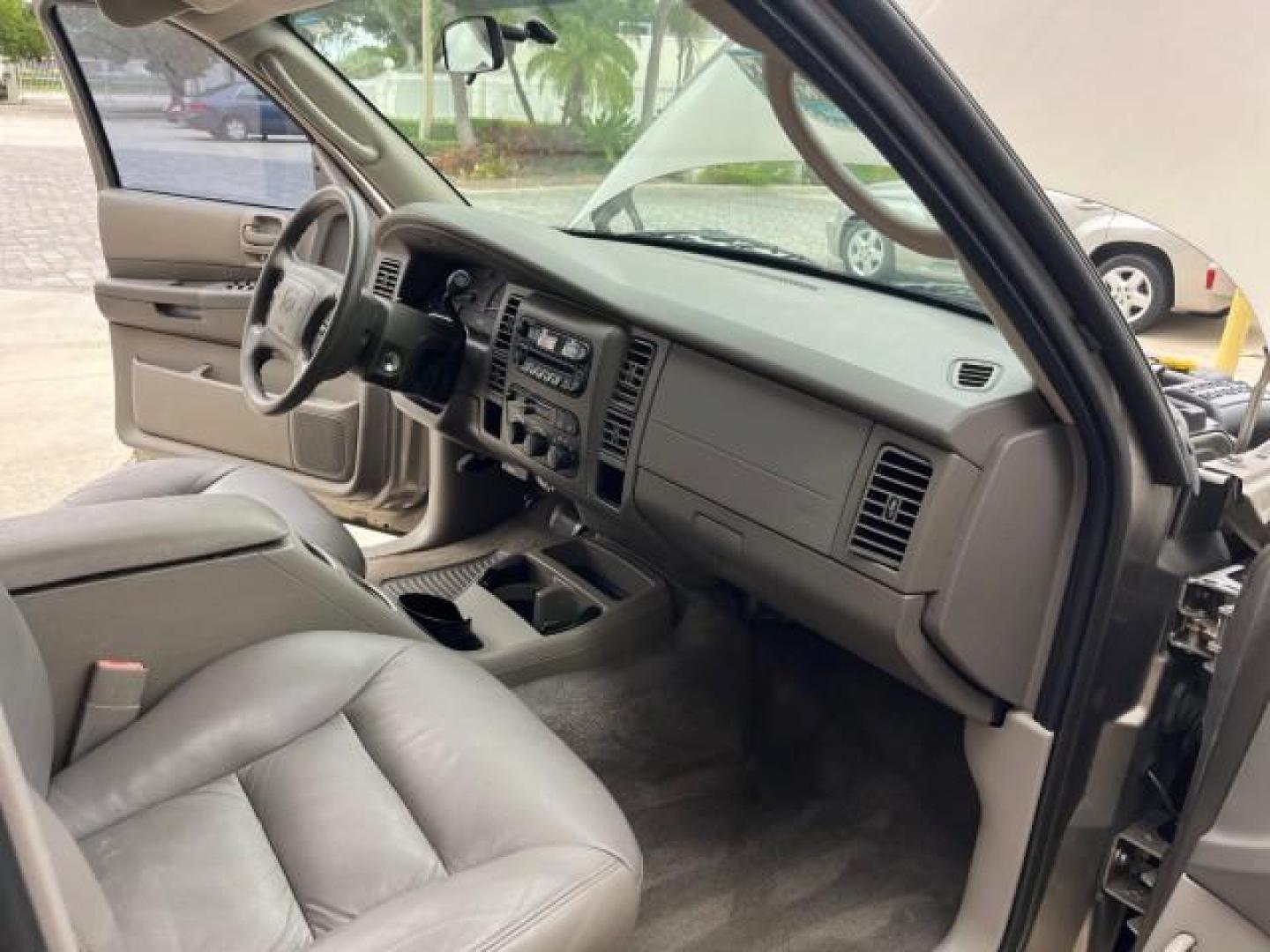 2003 Light Almond Pearl Metallic /Sandstone Dodge Durango 1 FL Sport LOW MILES 61,144 (1D4HR38N53F) with an 4.7L SOHC SMPI V8 Magnum Engine engine, Automatic transmission, located at 4701 North Dixie Hwy, Pompano Beach, FL, 33064, (954) 422-2889, 26.240938, -80.123474 - OUR WEBPAGE FLORIDACARS1.COM HAS OVER 100 PHOTOS AND FREE CARFAX LINK 2003 DODGE DURANGO SPORT ROAD READY 4.7L V8 VIN: 1D4HR38N53F615237 NO ACCIDENTS 4 DOOR WAGON/SPORT UTILITY NO RECALLS 4.7L V8 F OHV 1 OWNER FLORIDA GASOLINE DUAL AC LOW MILES 61,144 REAR WHEEL DRIVE 15 SERVICE RECORDS 3 ROW LEATHE - Photo#26